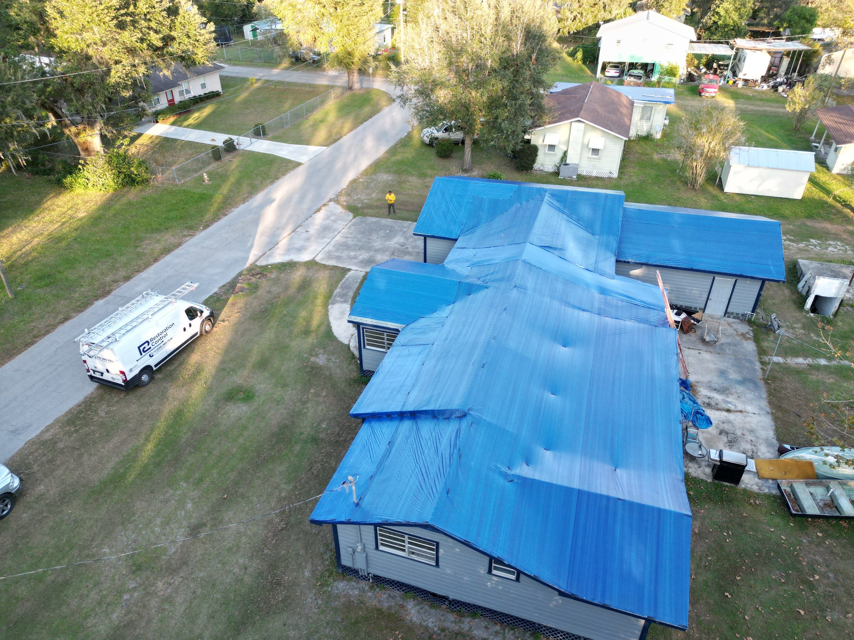 Tarp using TARP BLUE by AquaShield Restoration USA