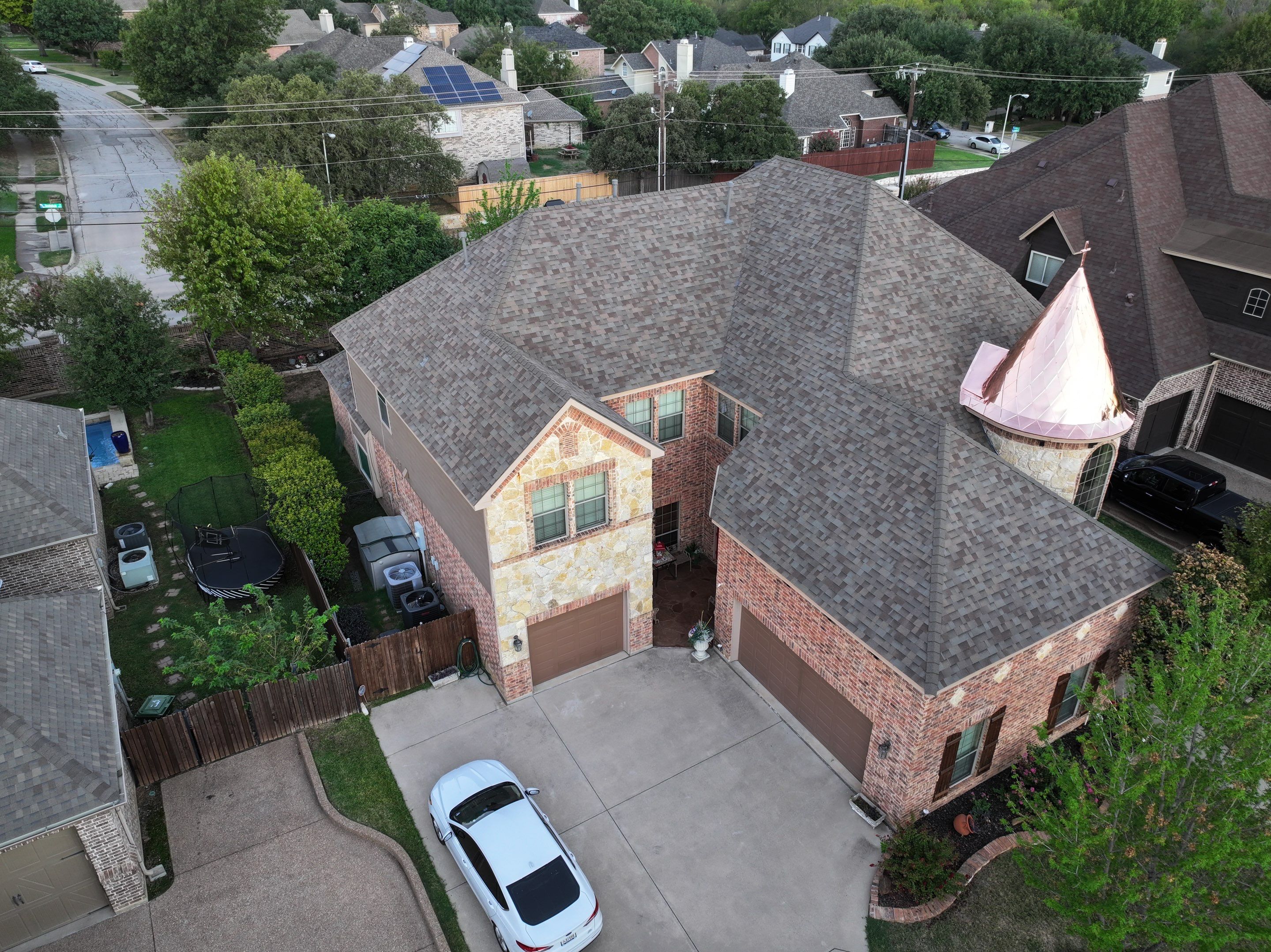 Installing Custom copper turret and Malarkey Vista Class 4 shingles Hail Damage Upgrade by Becker Roofing and Exteriors