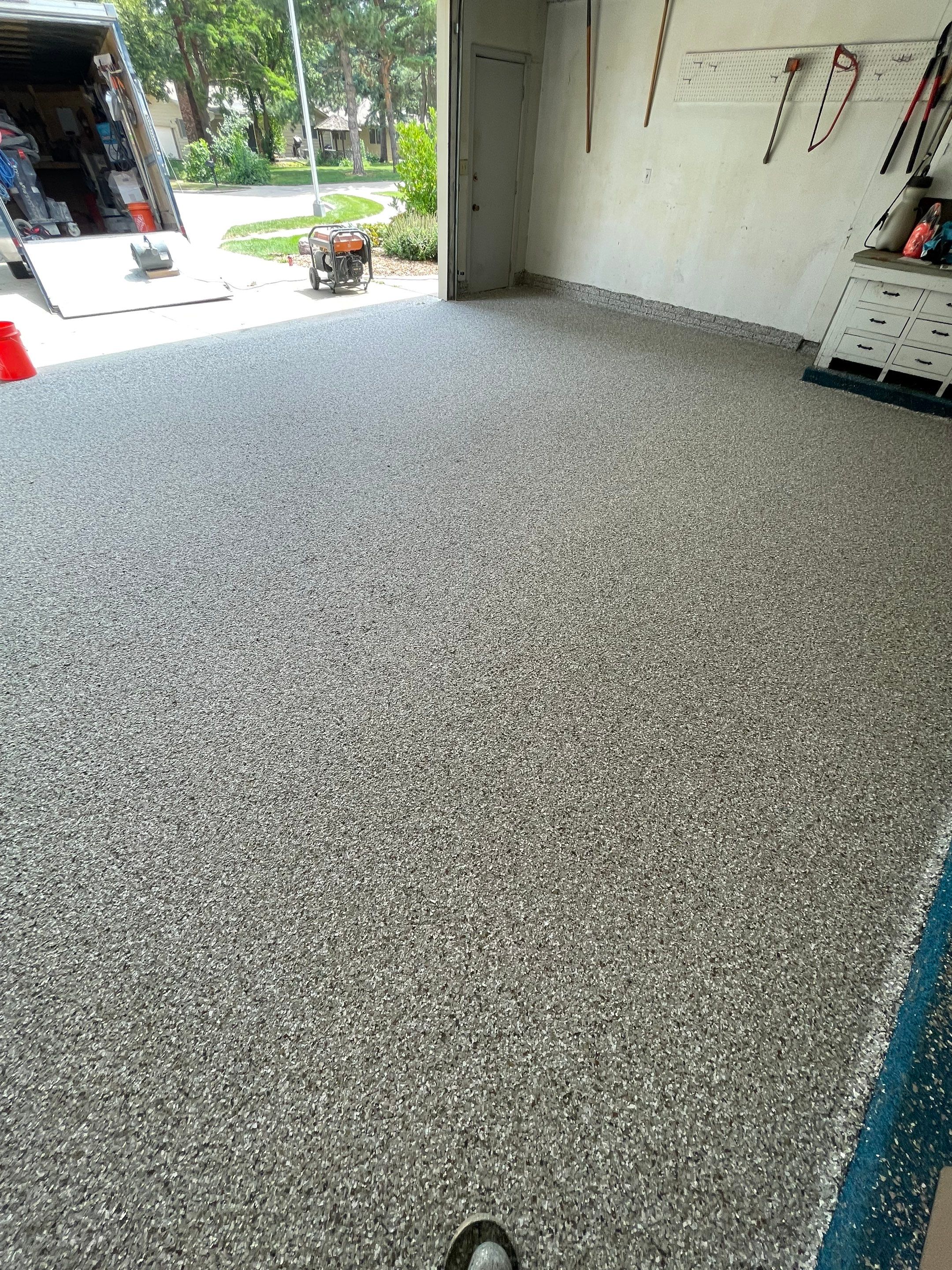 Custom Creekbed Garage Floor Coating in Sioux Falls by Select Painting, Coatings & Garage Cabinets