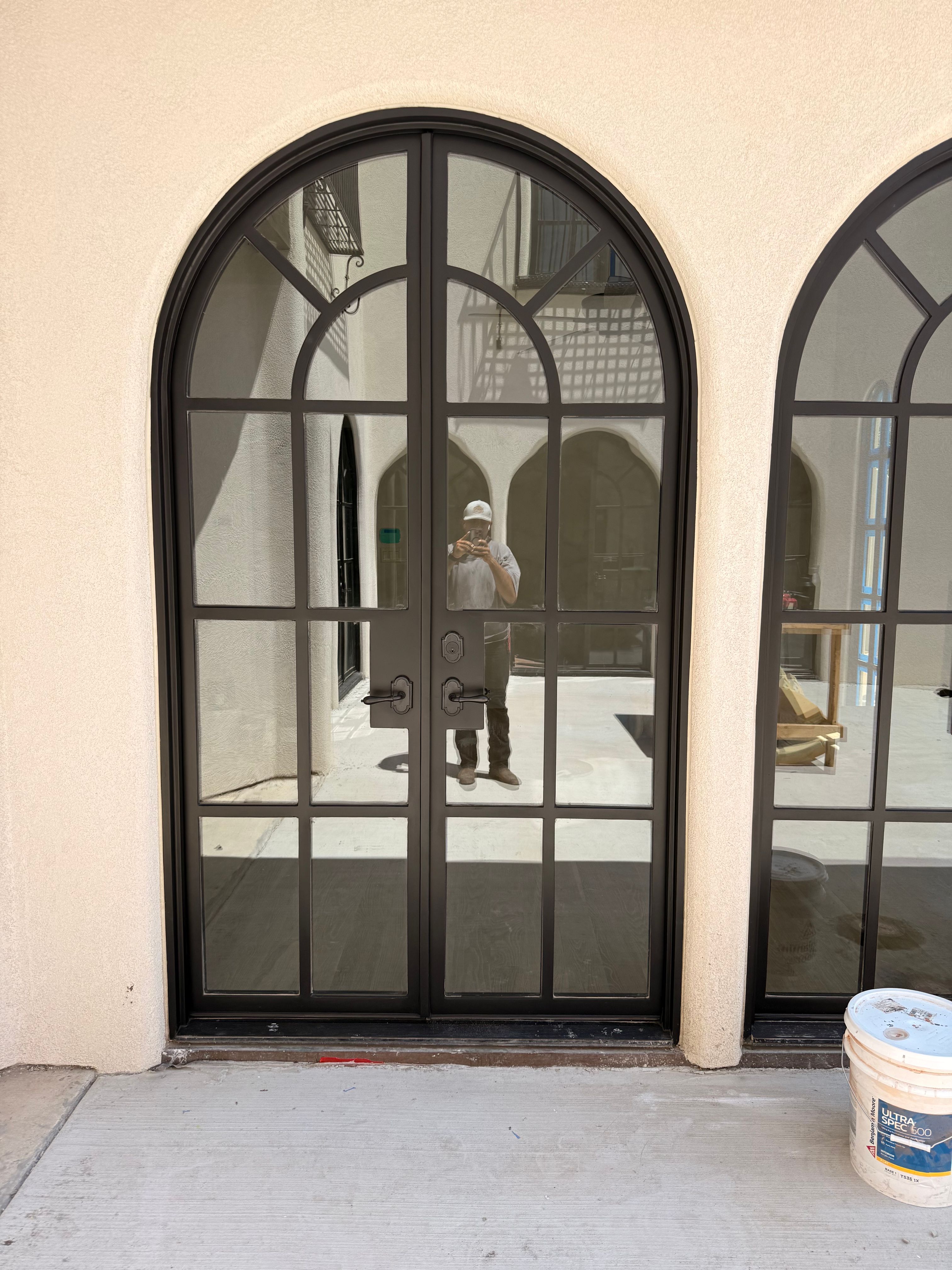Arched Black Metal French Door Installation and Finishing in Fort Worth by Solara Custom Living