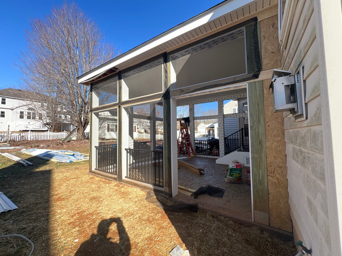 Custom Screened-In Porch with Stamped Concrete Patio in Warrenton by Jakari Restoration & Construction LLC