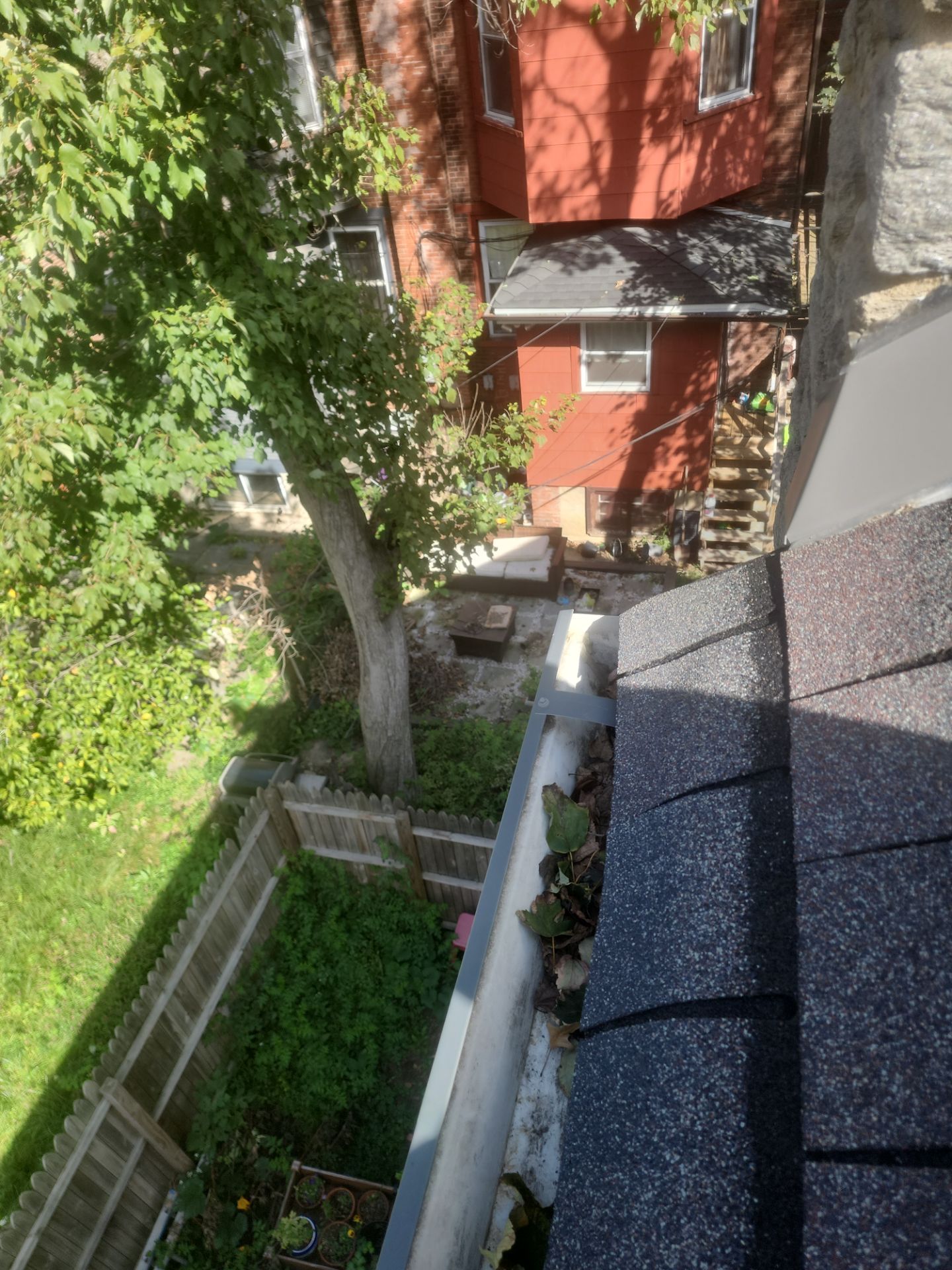 Commercial gutter cleaning Philadelphia before photo with filled gutters
