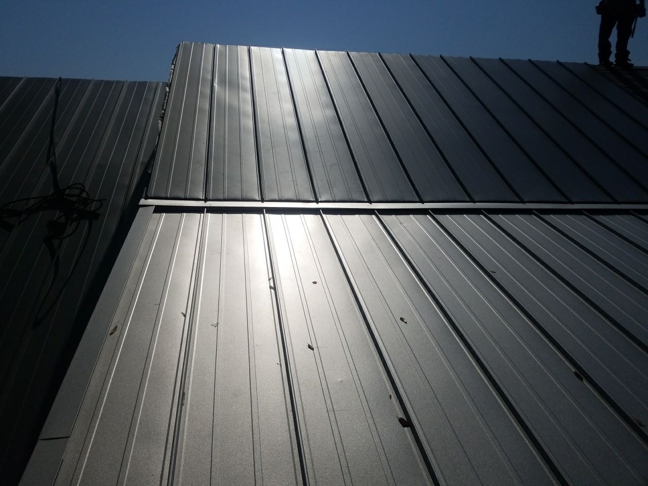 Residential Roofing Installation using Metal roofing by American Roofing & Construction LLC