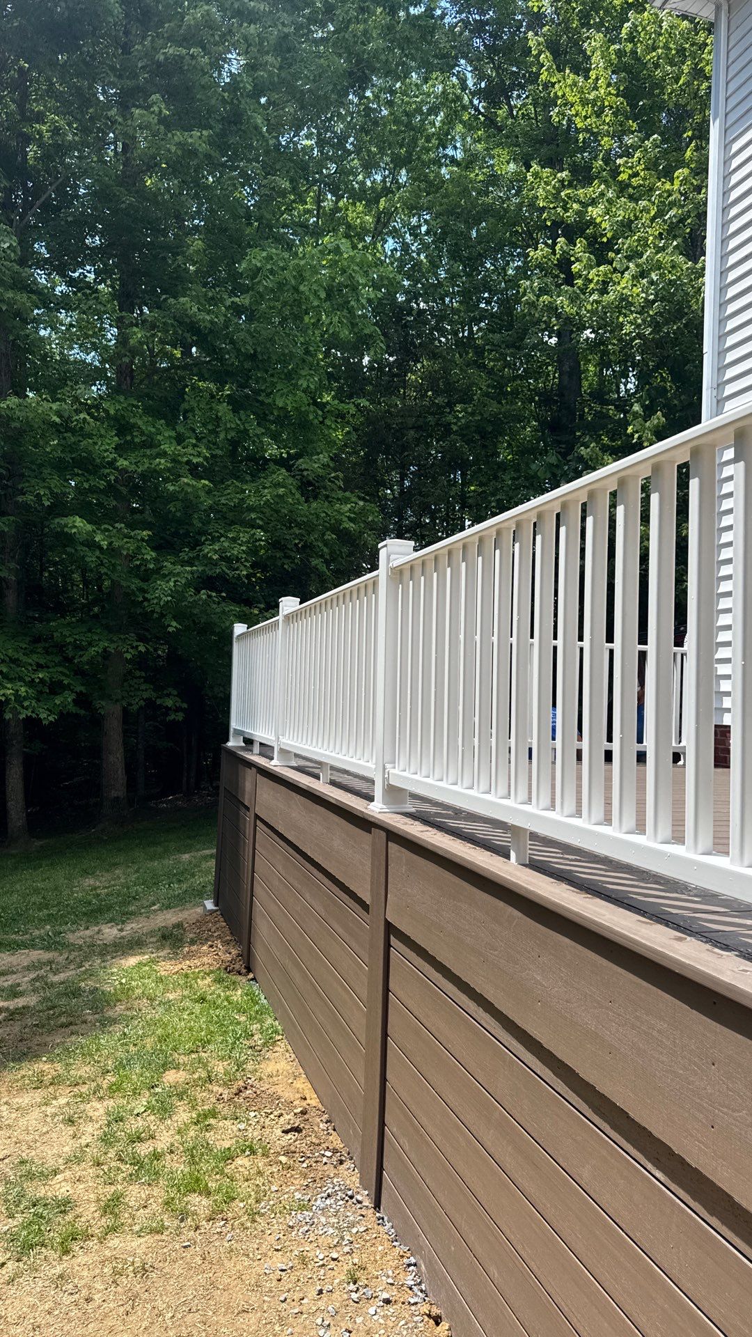 Custom Composite Deck and White Vinyl Railing Installation in Fayetteville by Walnut Hollow Decks & Outdoor Living