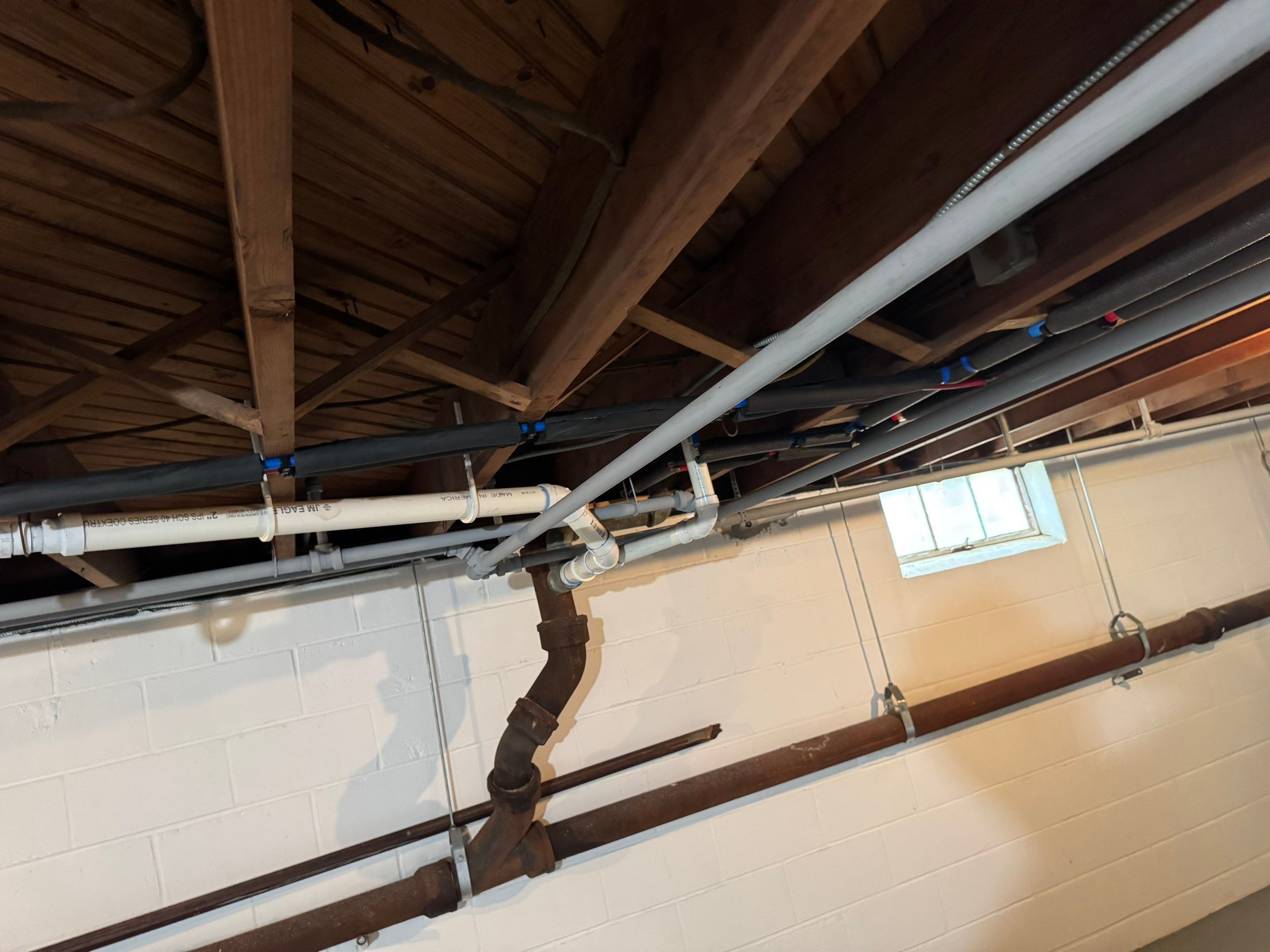 Window wells, exterior painting, basement waterproofing. by AXR Inc