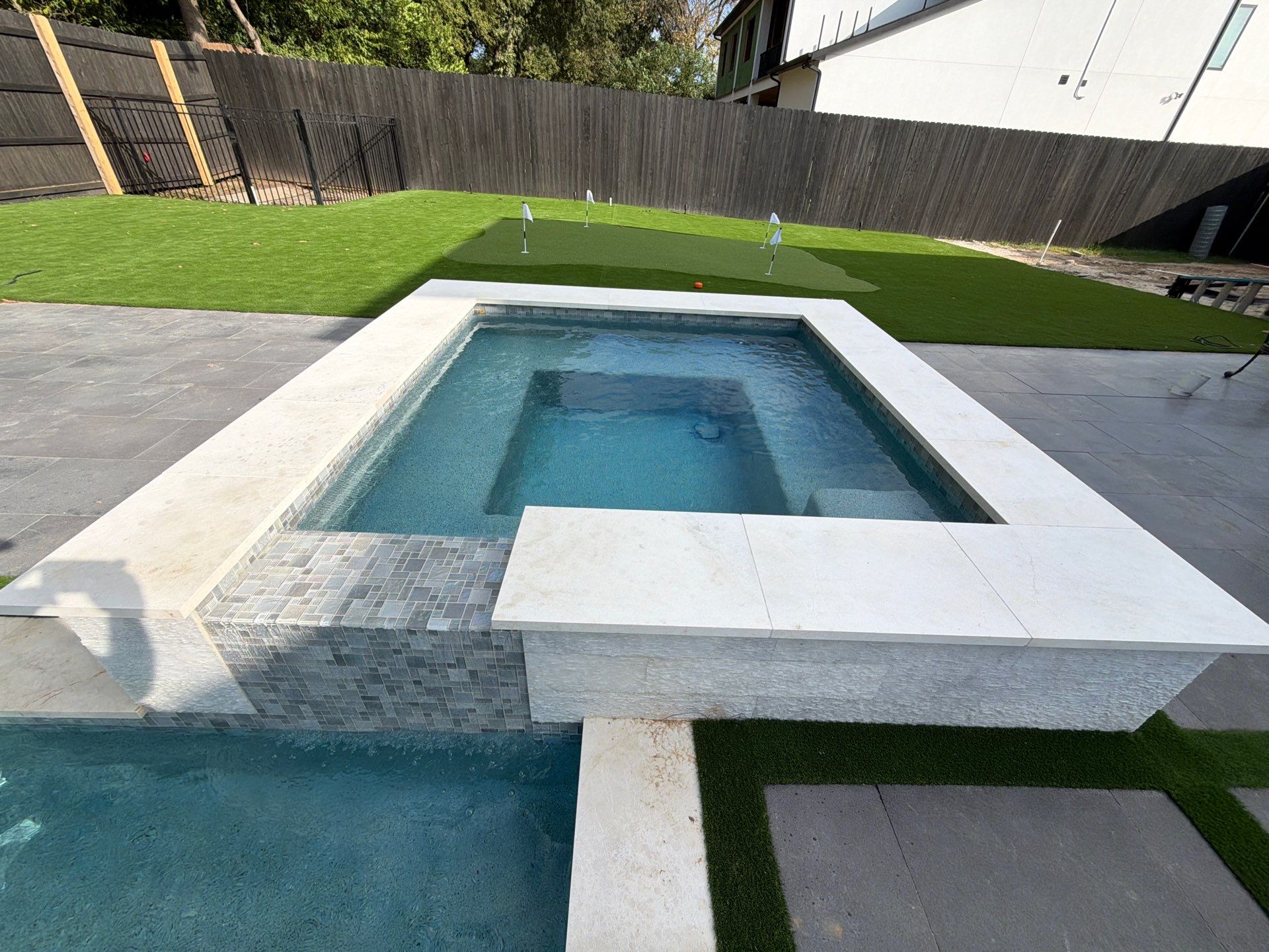Modern Geometric Pool with Raised Spa and Sheer Descents by Pinnacle Pools and Spas - DFW