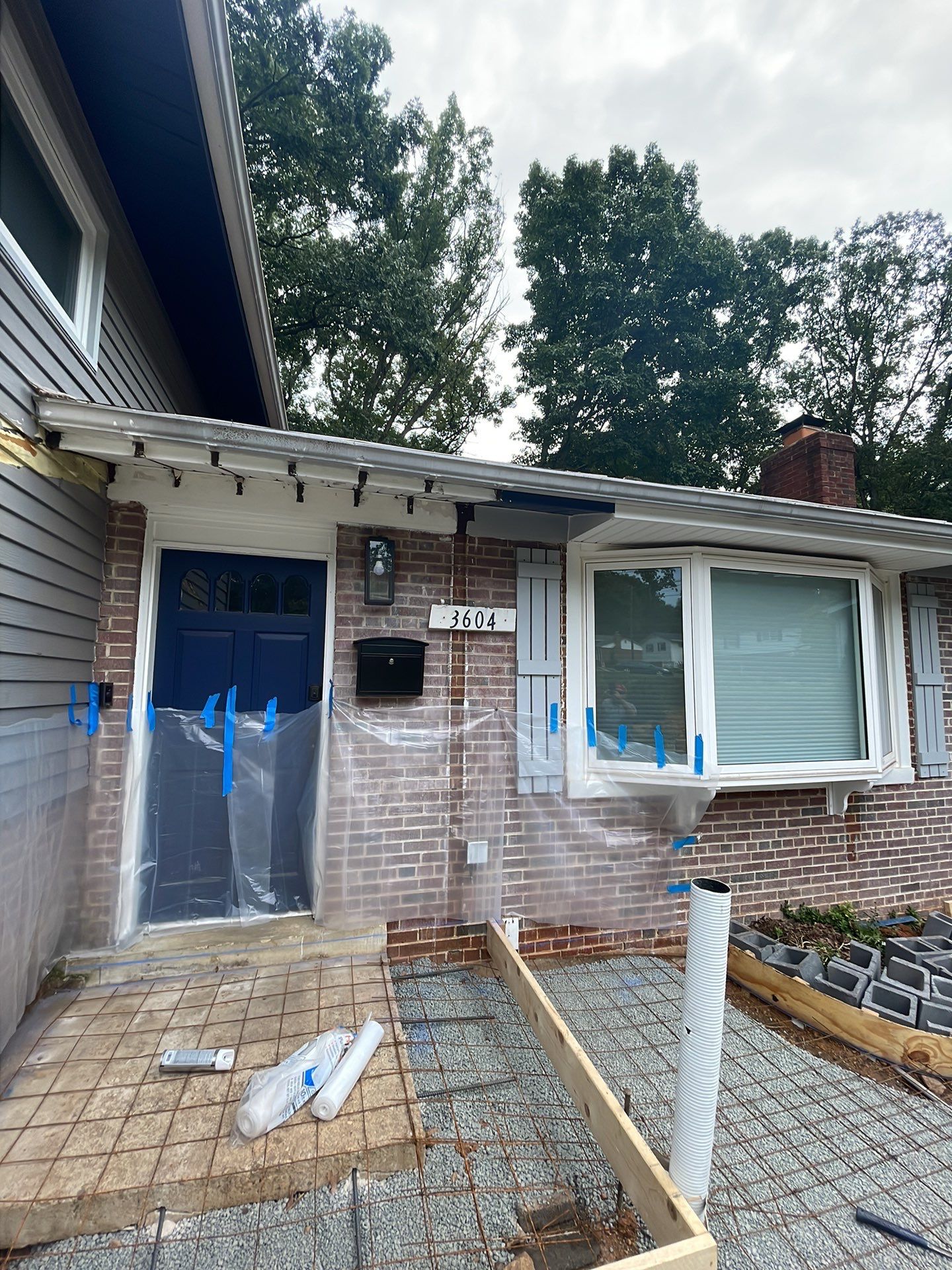 New walkway with stairs and a new front porch by Fairfax Contractors, LLC