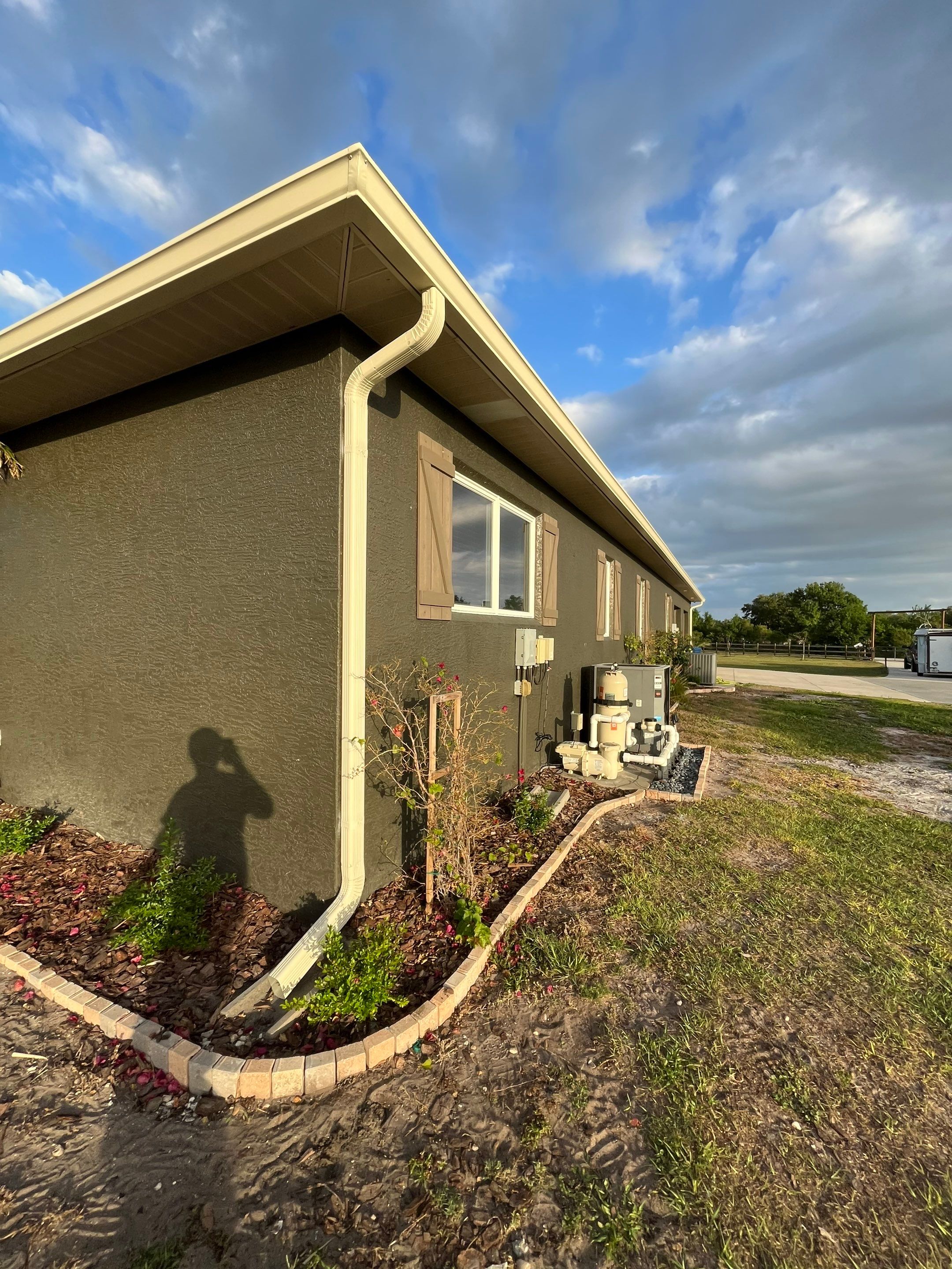  7-inch White seamless gutters and downspouts in Myakka City FL by Gutter Professors