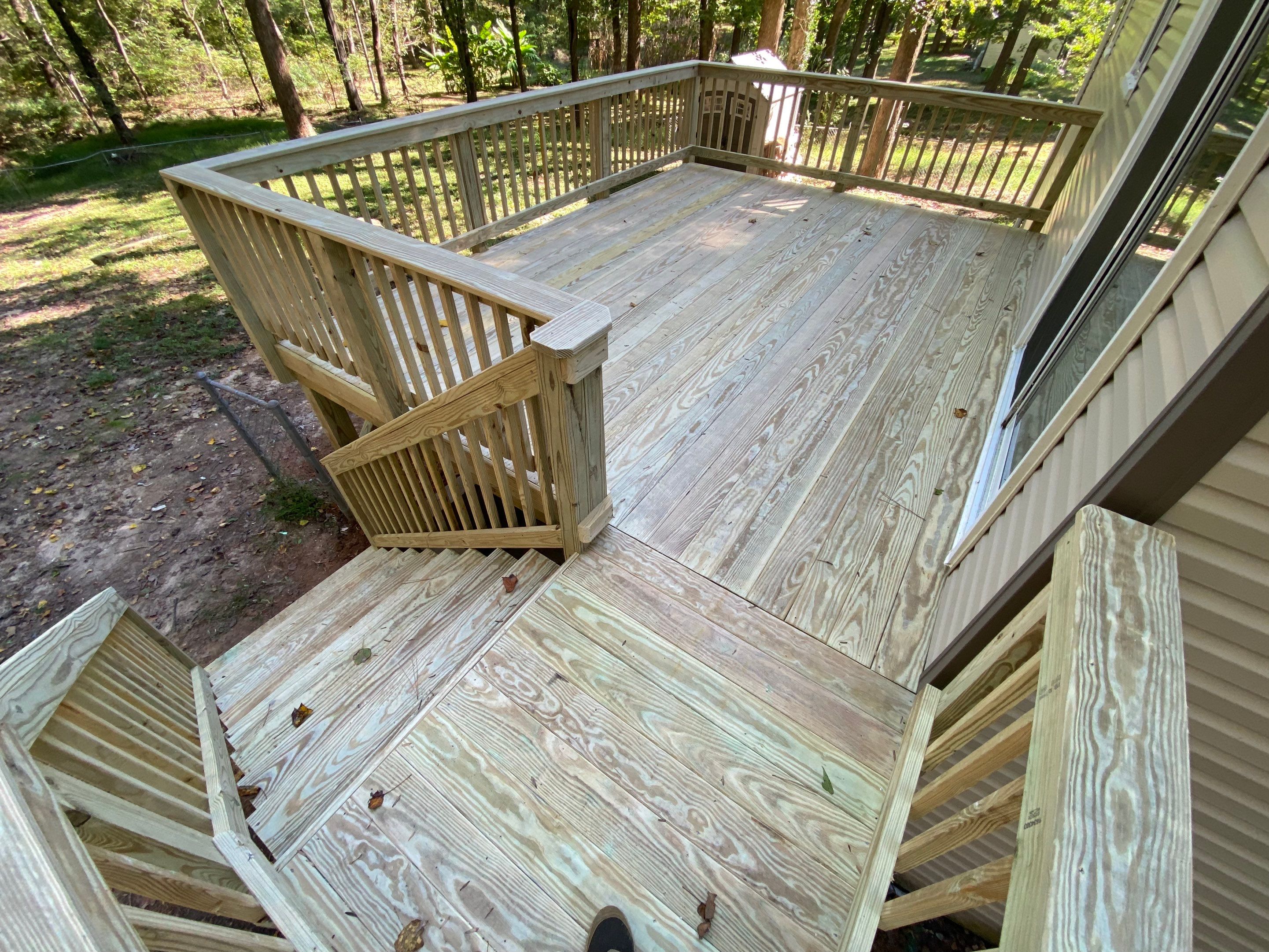 Custom Elevated Pressure-Treated Wood Deck Installation in Raleigh by The Remodeling Company