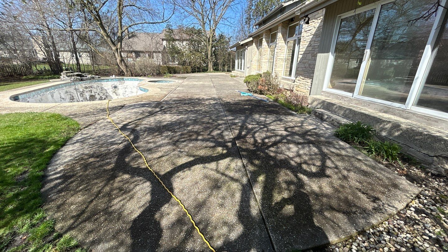 Aggregate Clean and seal using low gloss sealer by Northern Power Washing LLC.