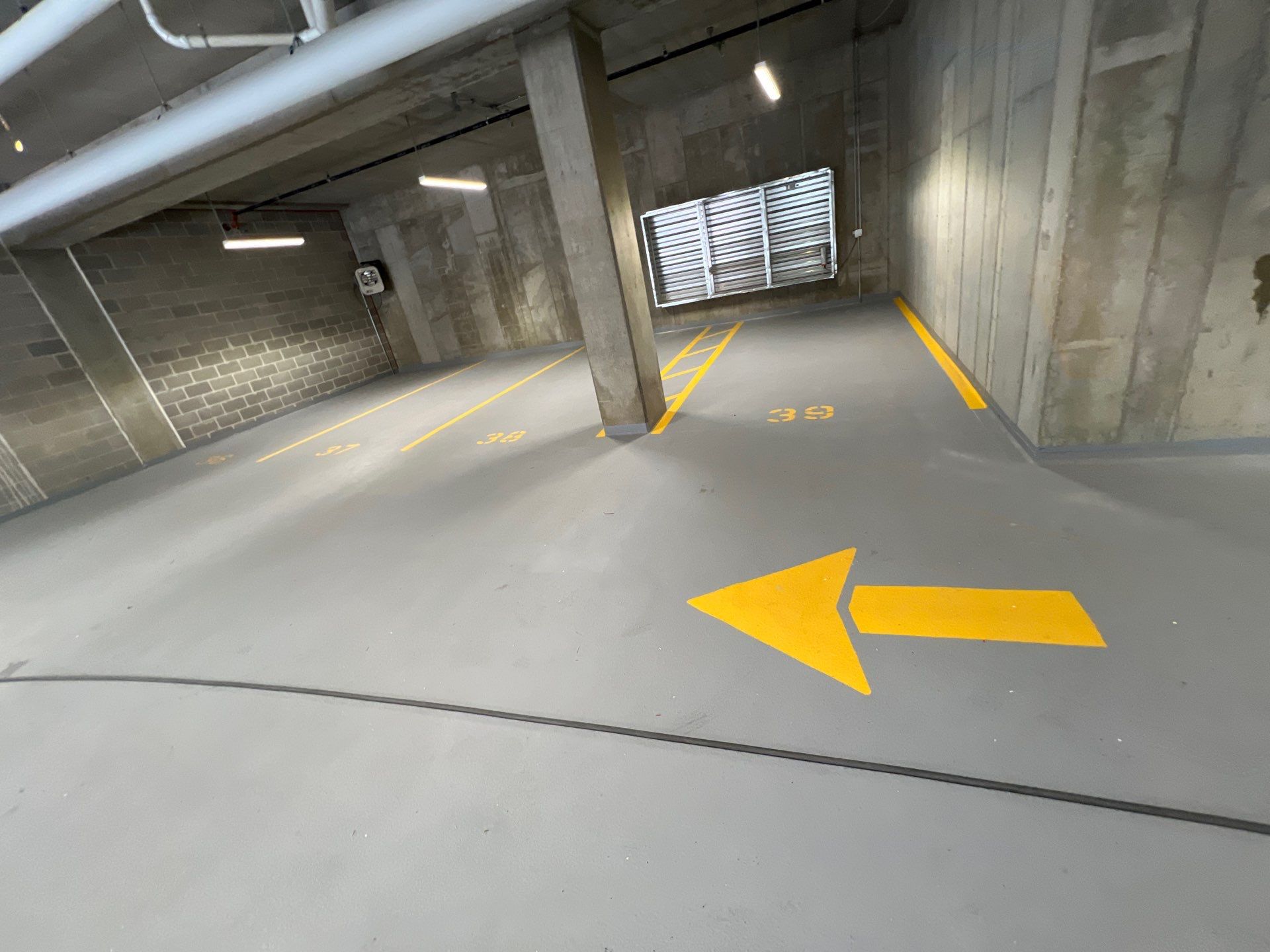 Parking garage using Hot water by Northern Power Washing LLC.