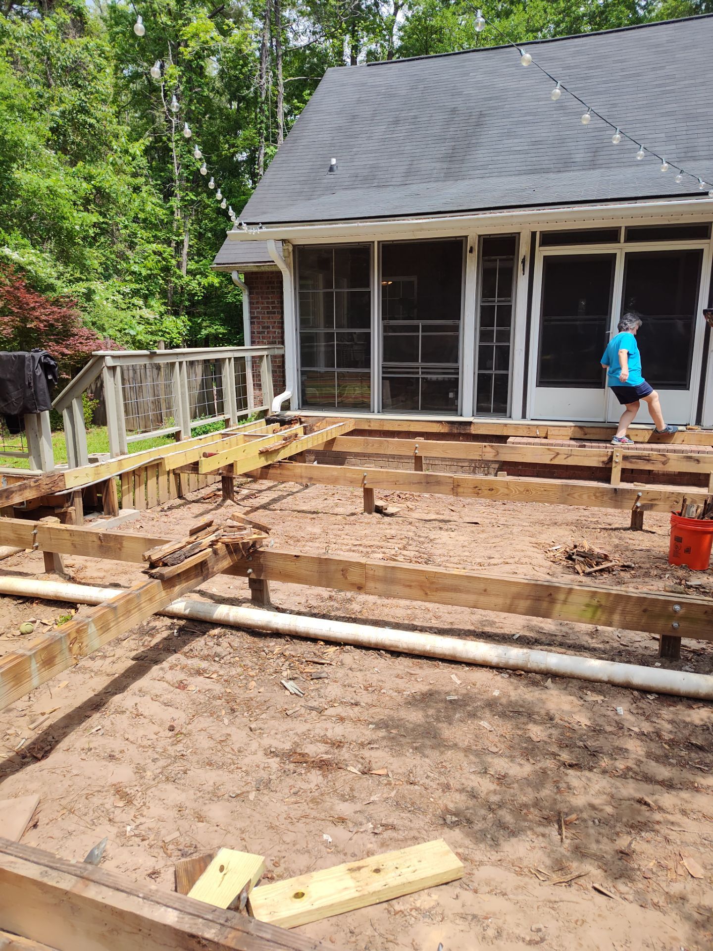 Patio in concrete with drainage improvements by Cornerstone Home Builders, LLC