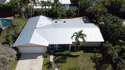 Residential Roofing Installation using 1" Nail strip metal roof