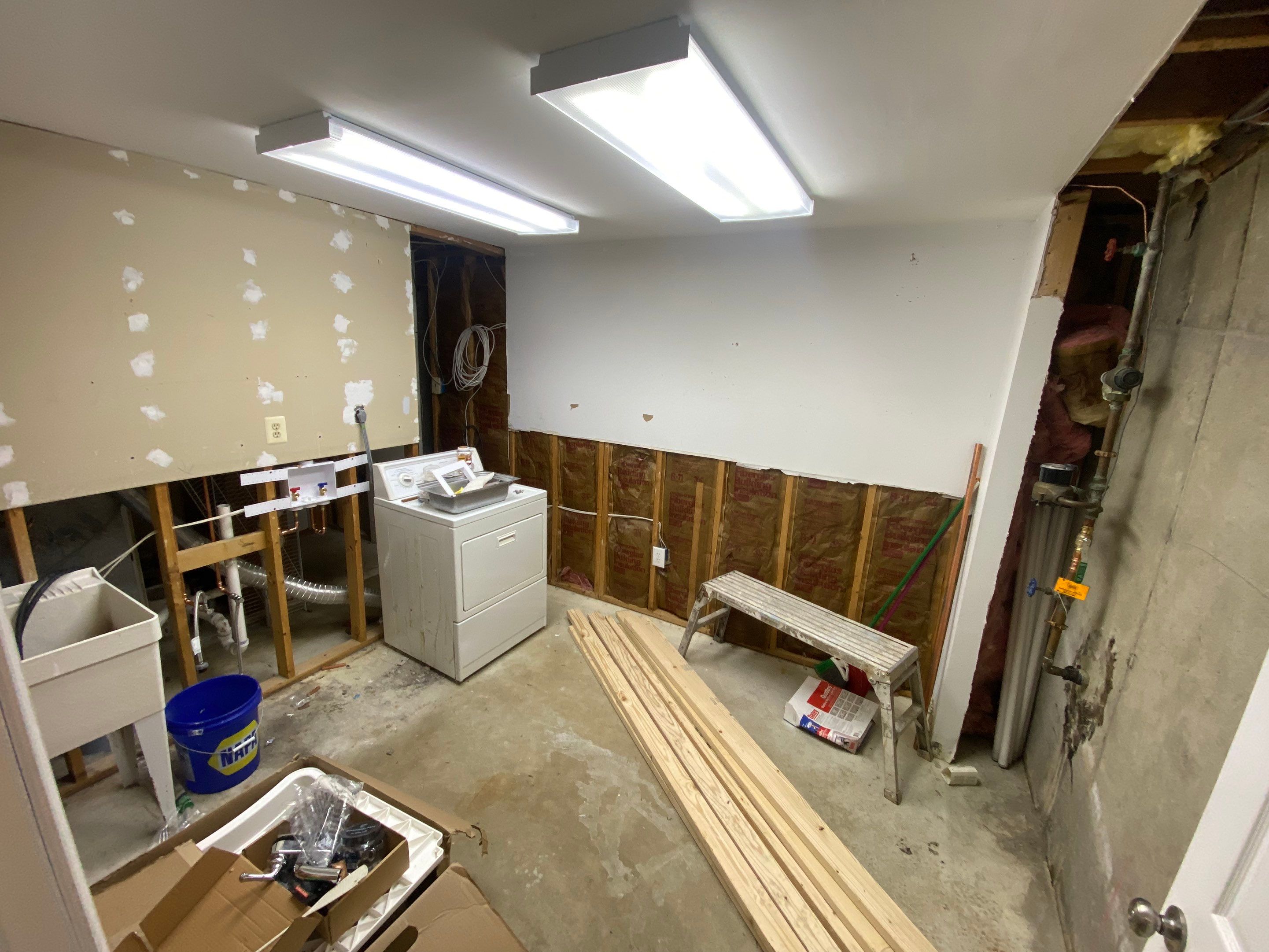 Laundry Room Redmodel using Lifeproof Luxury Vinyl Plank Flooring by The Smet Companies, LLC
