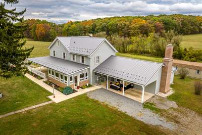 Classic Farmhouse With Textured Charcoal Metal Roof