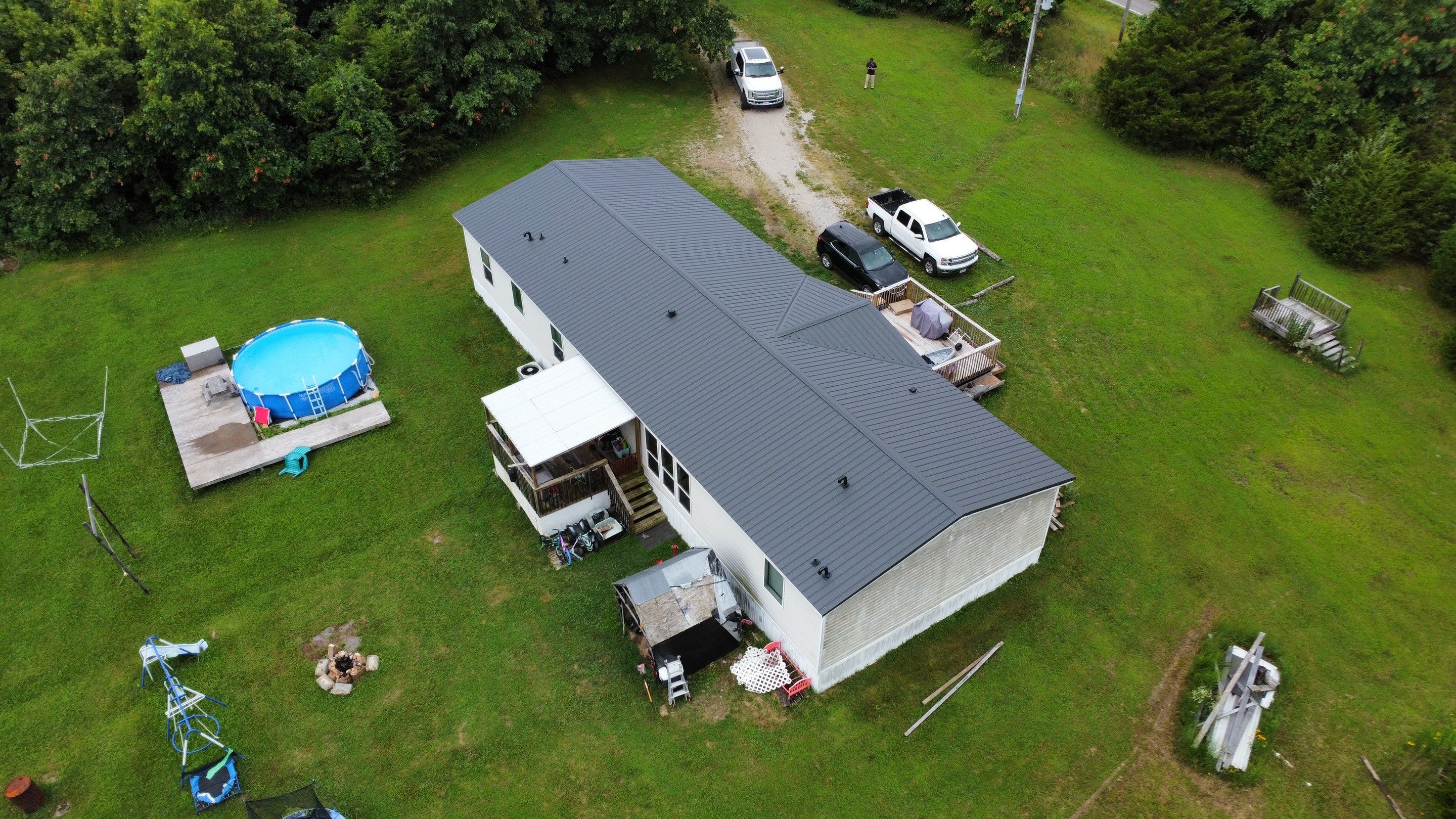 Residential Roofing Install - 29 Guage G-Rib Metal - Color Black Frost  by Titan Commercial & Residential Roofing 