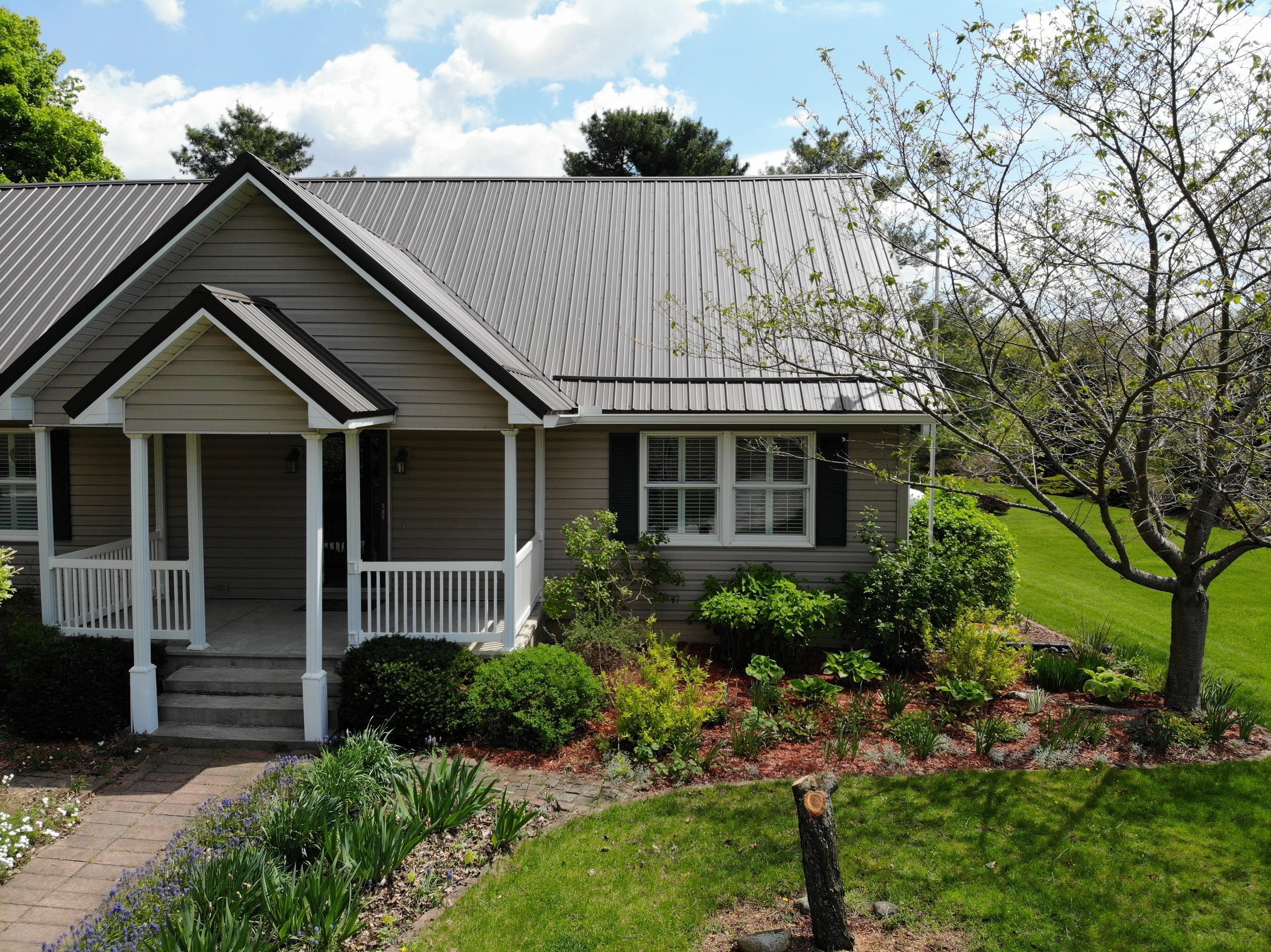 Burnished Slate Exposed Fastener Metal Roof That Withstood a Tornado in Ligonier, Indiana by 4Ever Metal Roofing