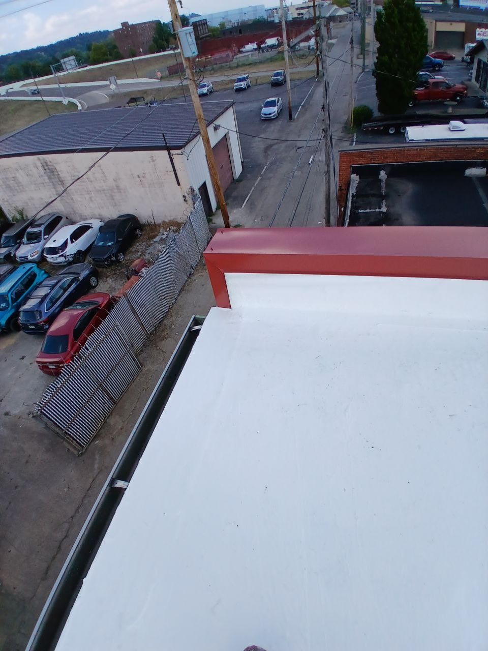 Commercial Roofing Installation using smartcoat Roof coating by Fahey Roofing + Contracting