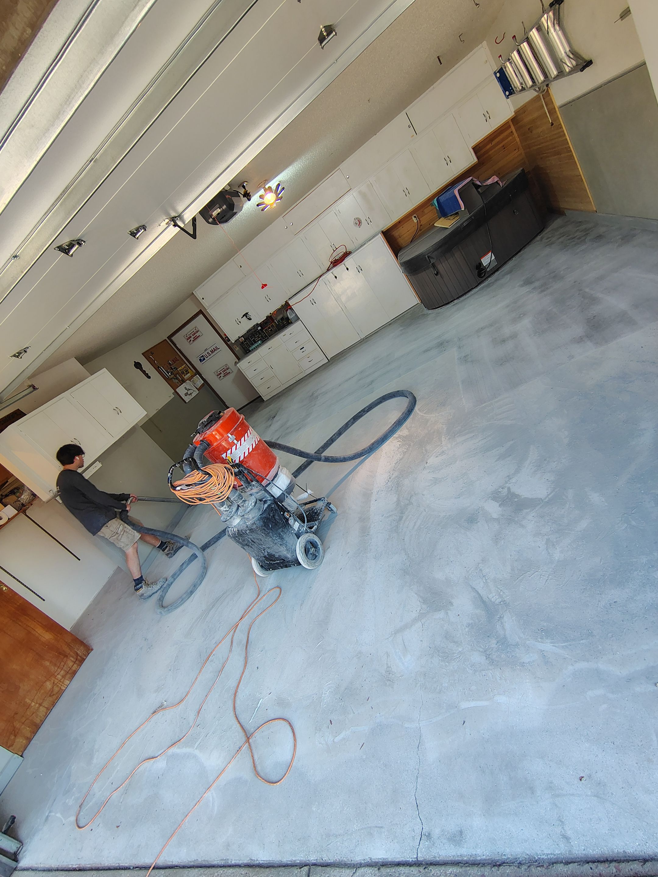 Domino Flake Garage Floor Coating Installation in Sioux Falls by Select Painting, Coatings & Garage Cabinets