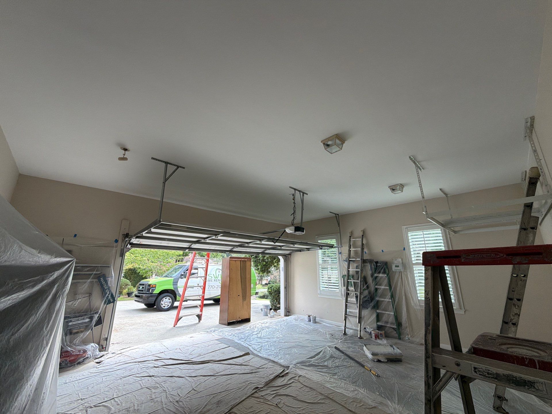 Multi-Story Stucco Home Exterior Painting and Garage Refresh in Marietta by Swift Home Renovations 