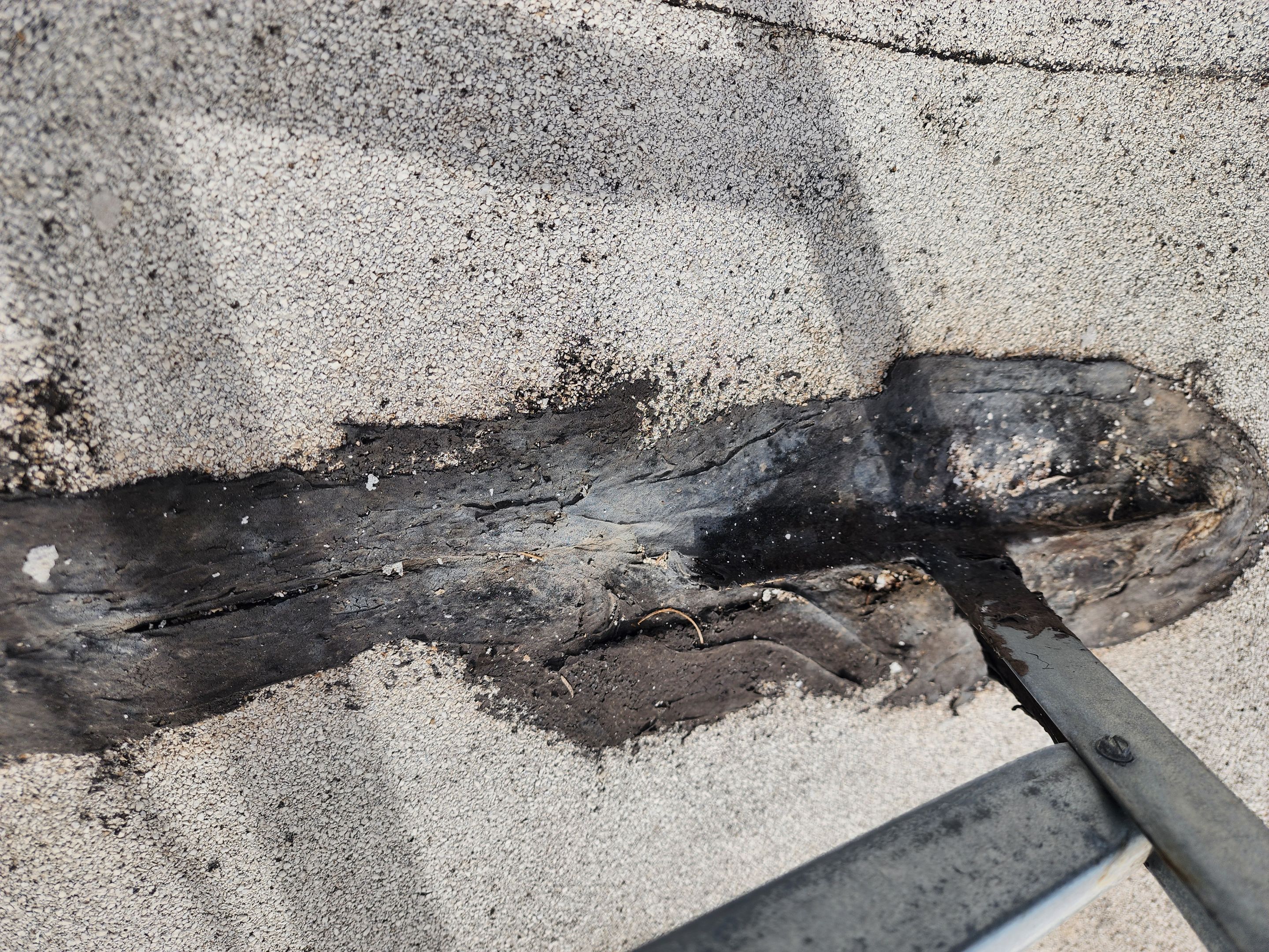 Foam and coatings on commercial roof by Straight Edge Roofing Inc