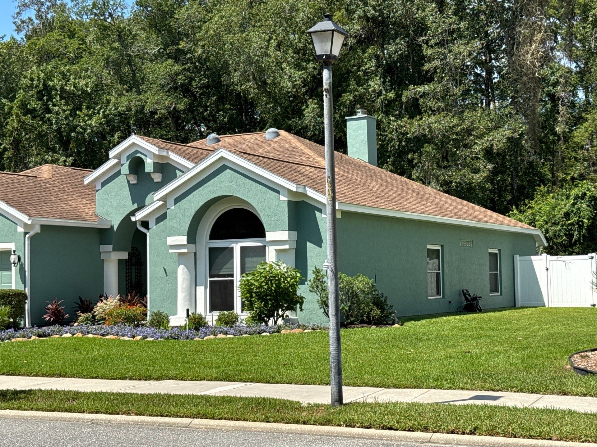 Stucco Exterior Repainting with White Soffits & Fascia | Hampton Park, Jacksonville, FL by A New Leaf Painting, LLC