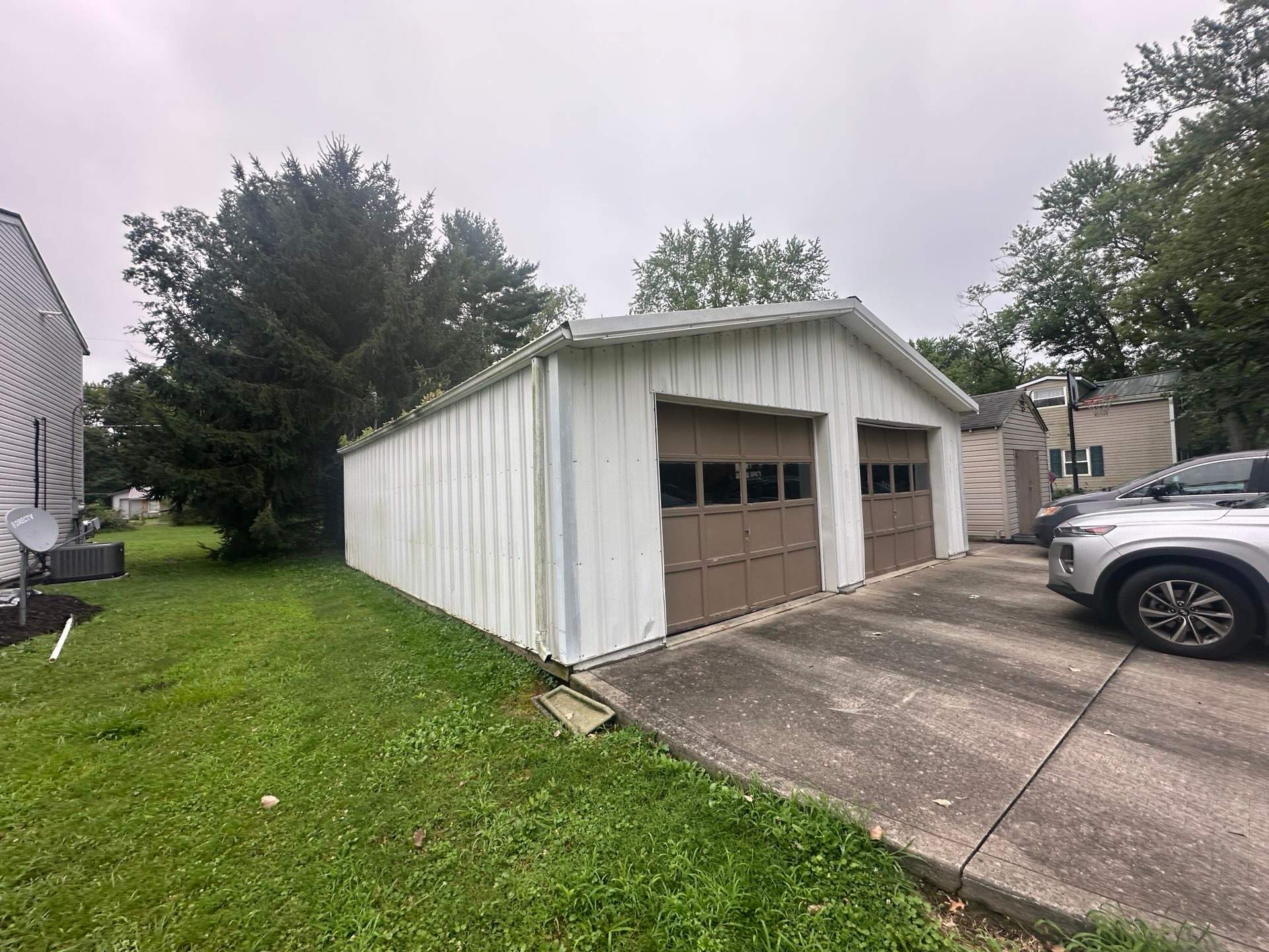Green Metal Roof Installation and Exterior Renovation in Thornville by Canopy Contracting