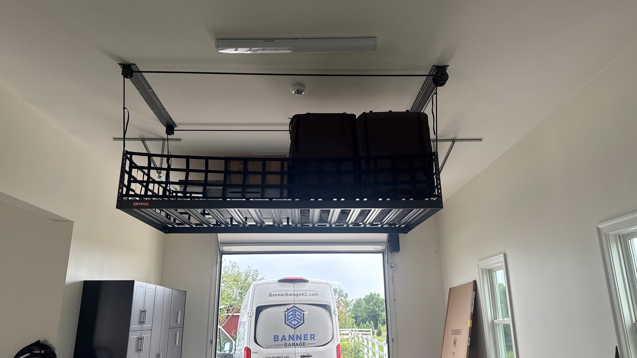 Mark Added Storage Plus A Motorized Lift by Banner Garage