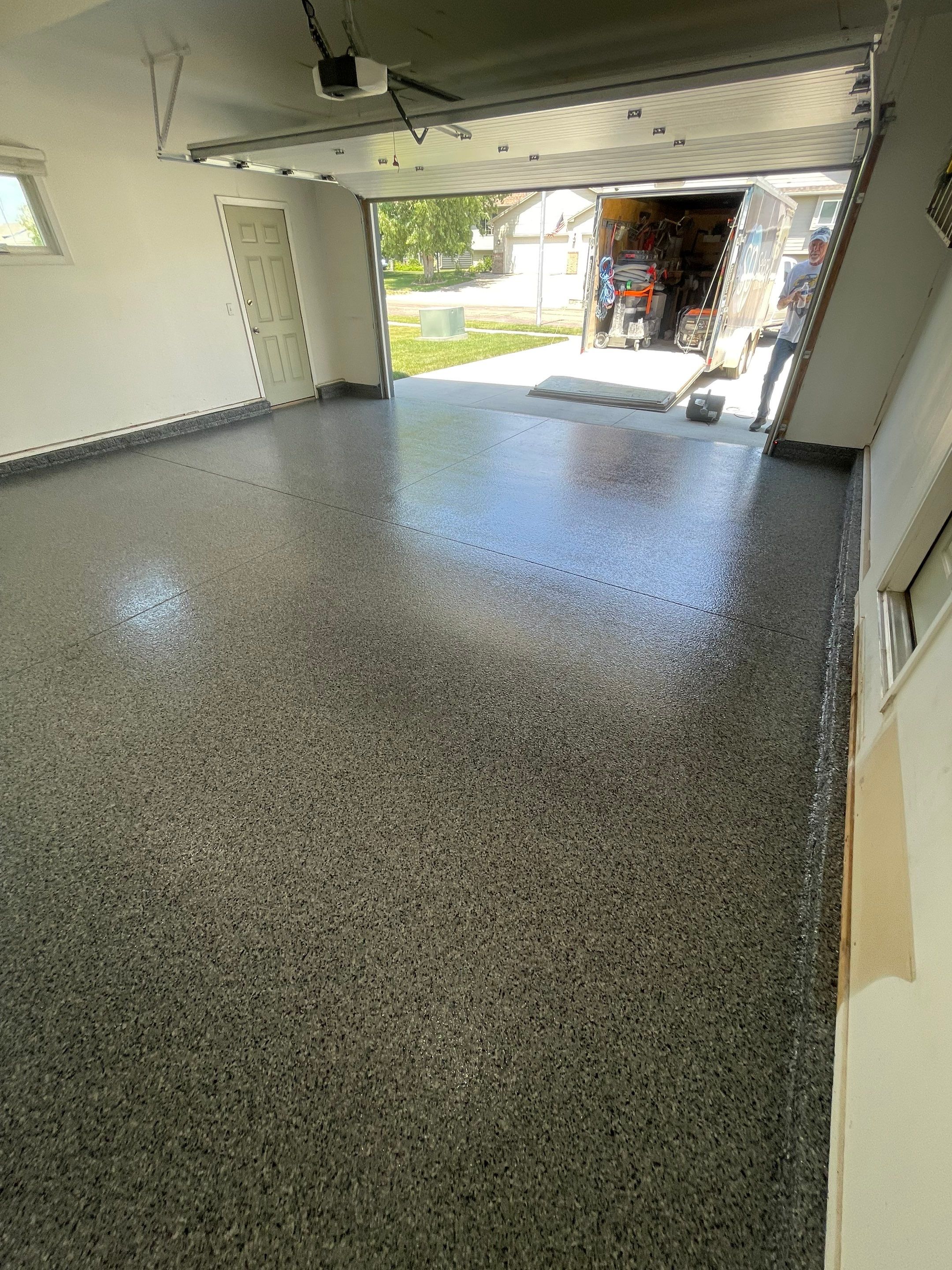 Sioux Falls Garage Floor Coating with Nightfall Decorative Chips by Select Painting, Coatings & Garage Cabinets
