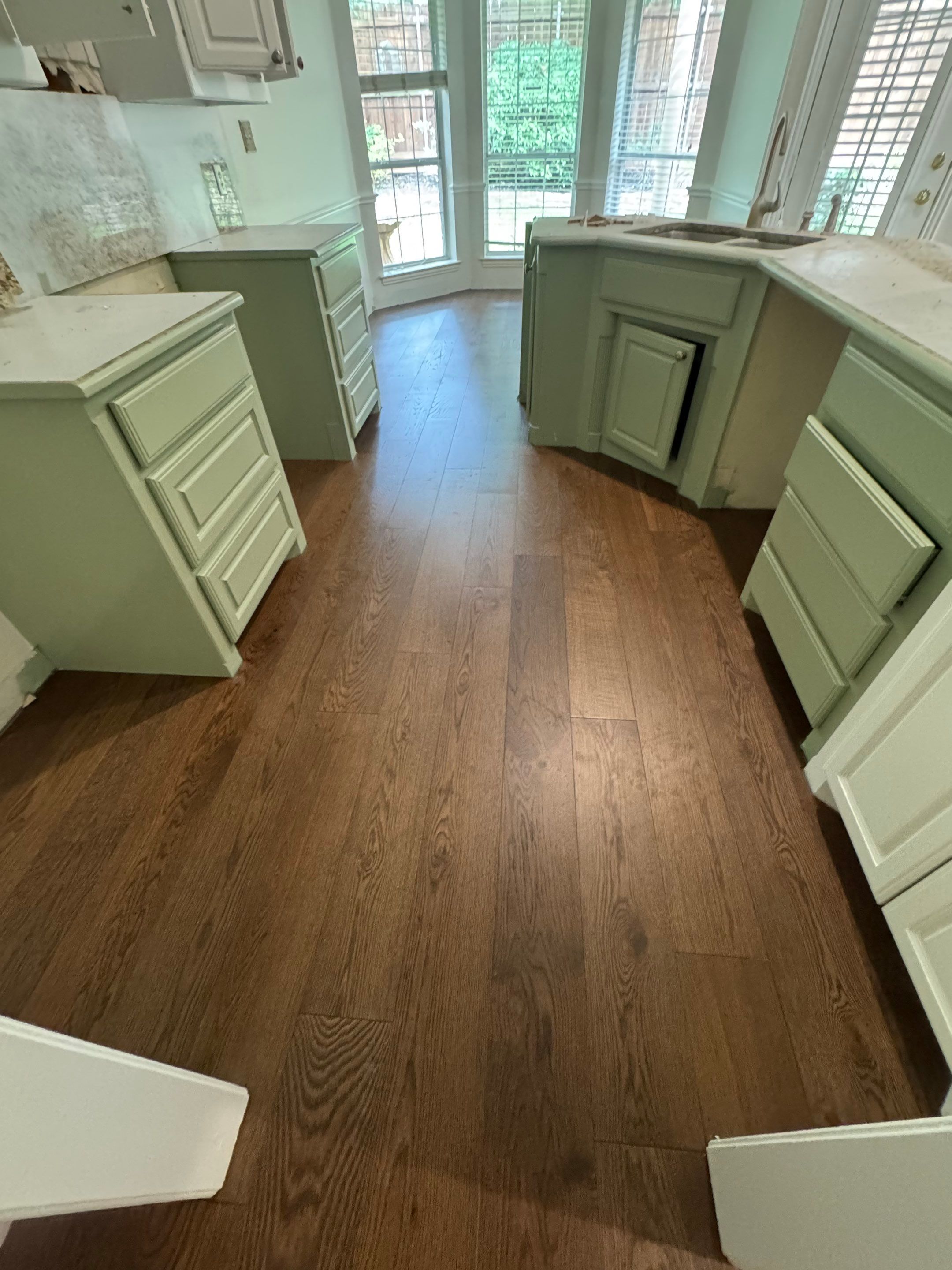 Interior Renovation with Dark Wood Floors and Geometric Fireplace Tile by Simmons Floors