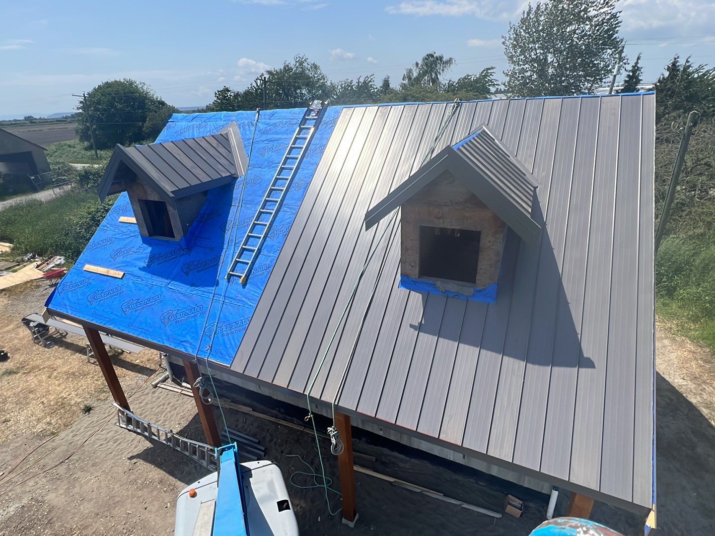 Agricultural Roofing Installation using 12" Prolok metal  by Top Notch Roofing Inc