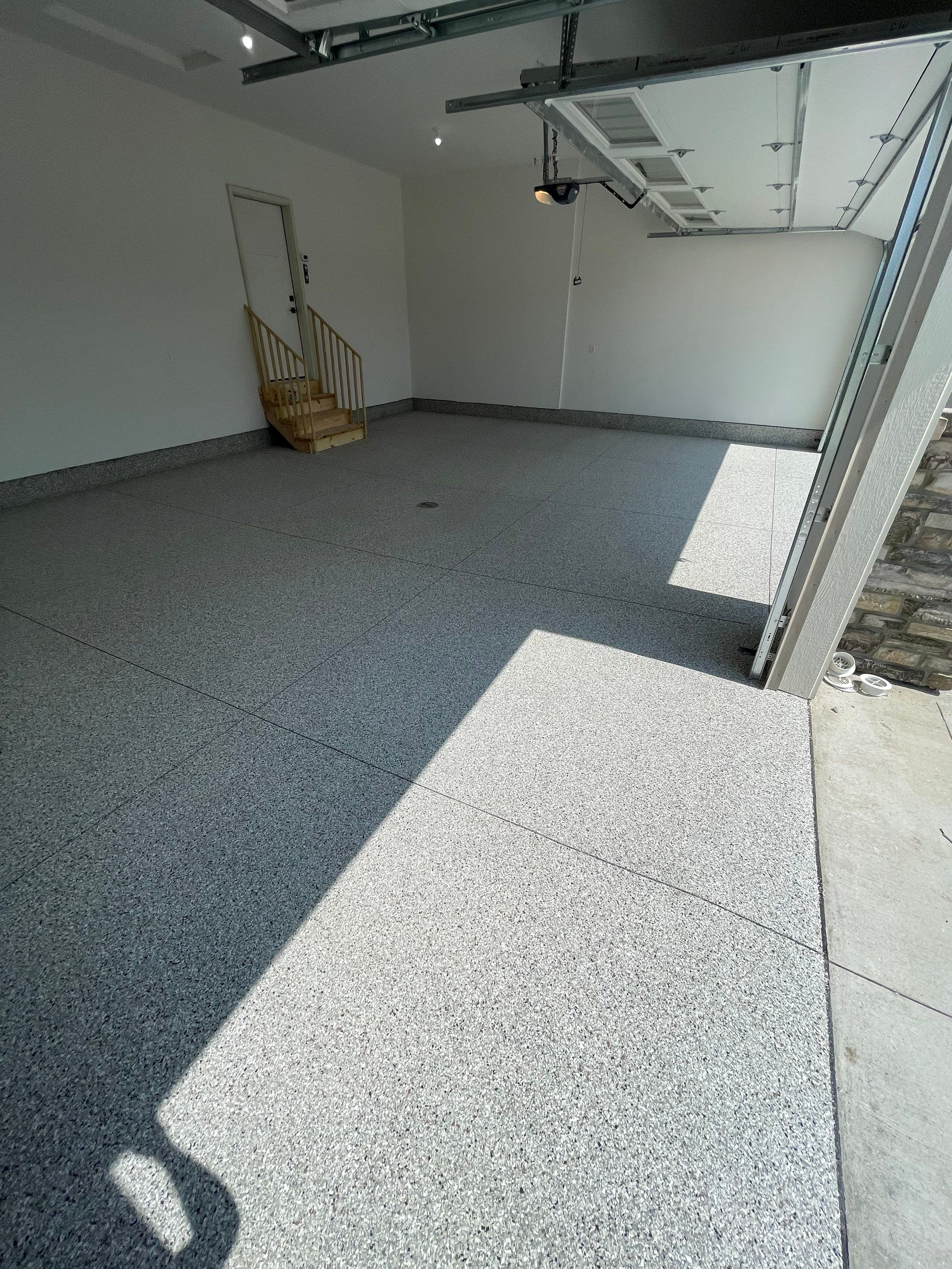 Grey Speckled Garage Floor Coating in Sioux Falls by Select Painting, Coatings & Garage Cabinets