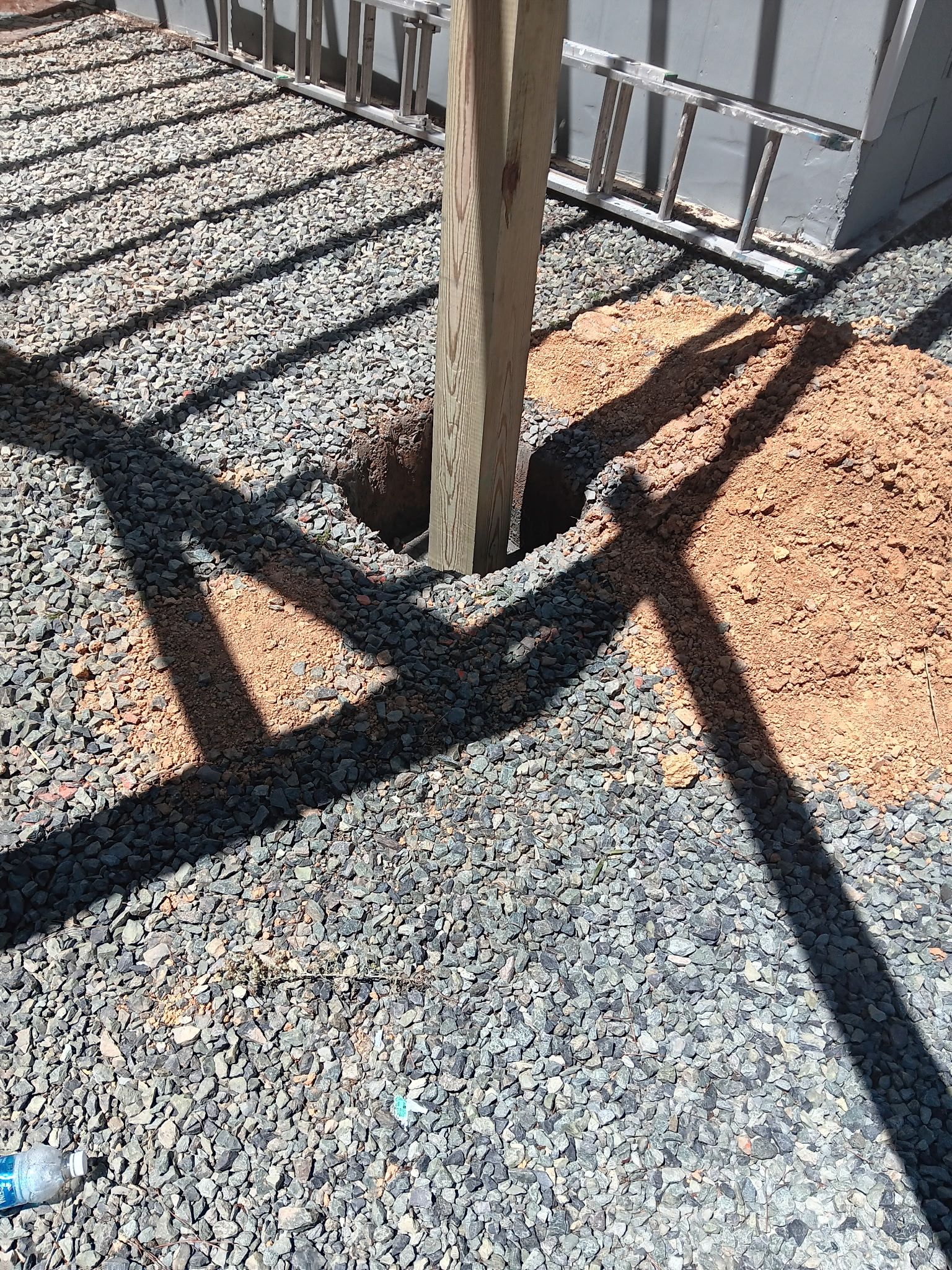 Pittsboro Outdoor Living Transformation – Retaining Wall, Paver Patio & Elevated Deck by Elite Remodeling and Design LLC