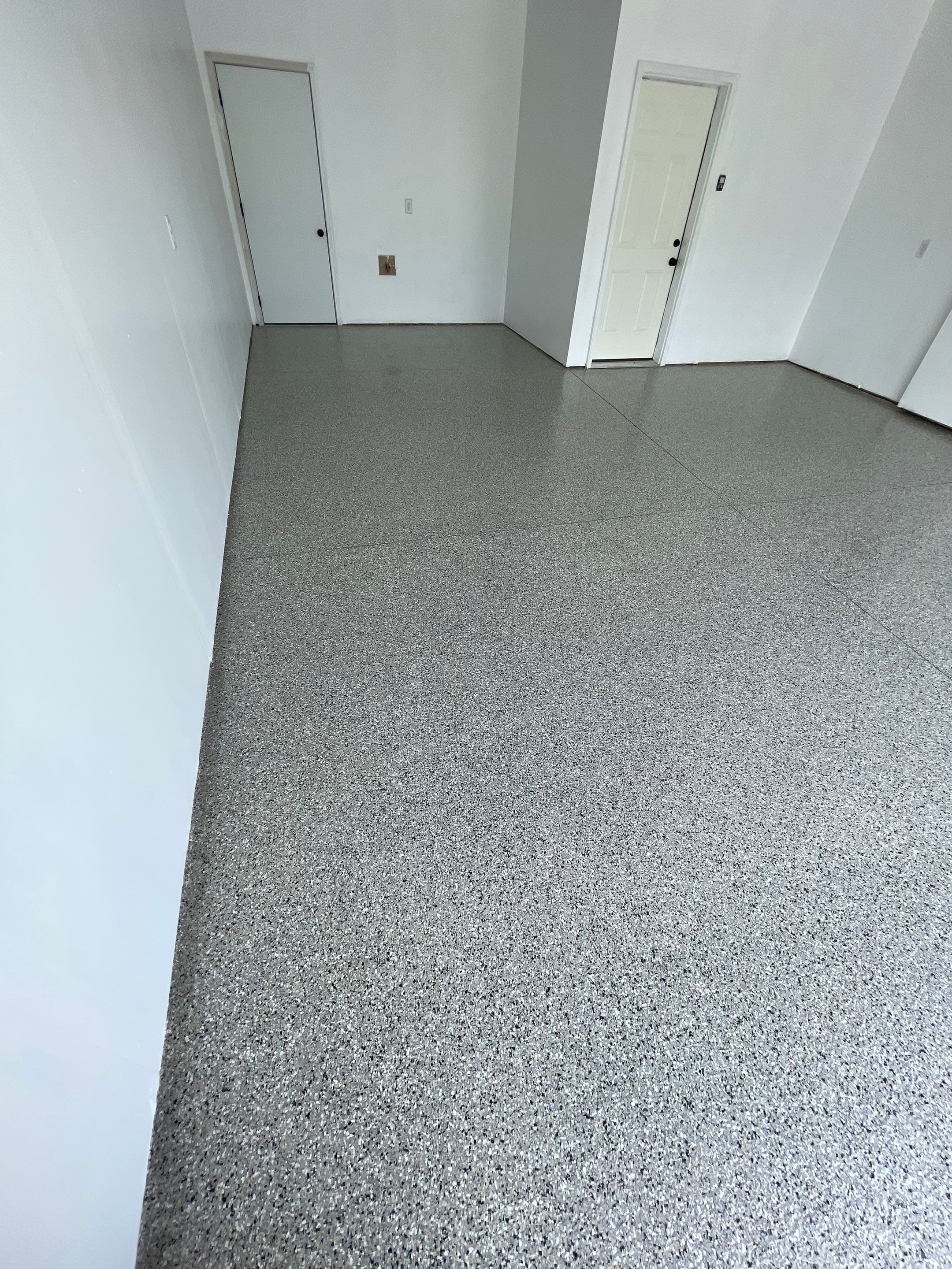 Sioux Falls Garage Floor Transformation with Cabin Fever Decorative Chips by Select Painting, Coatings & Garage Cabinets