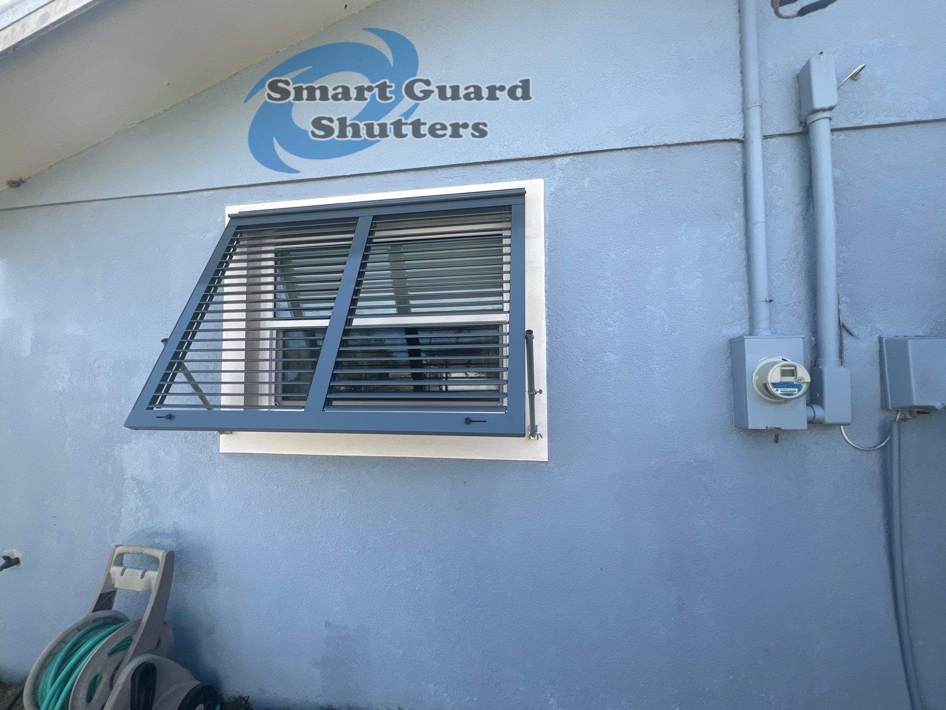 Impact Bahama Shutters in Grey Blue by Smart Guard Shutters