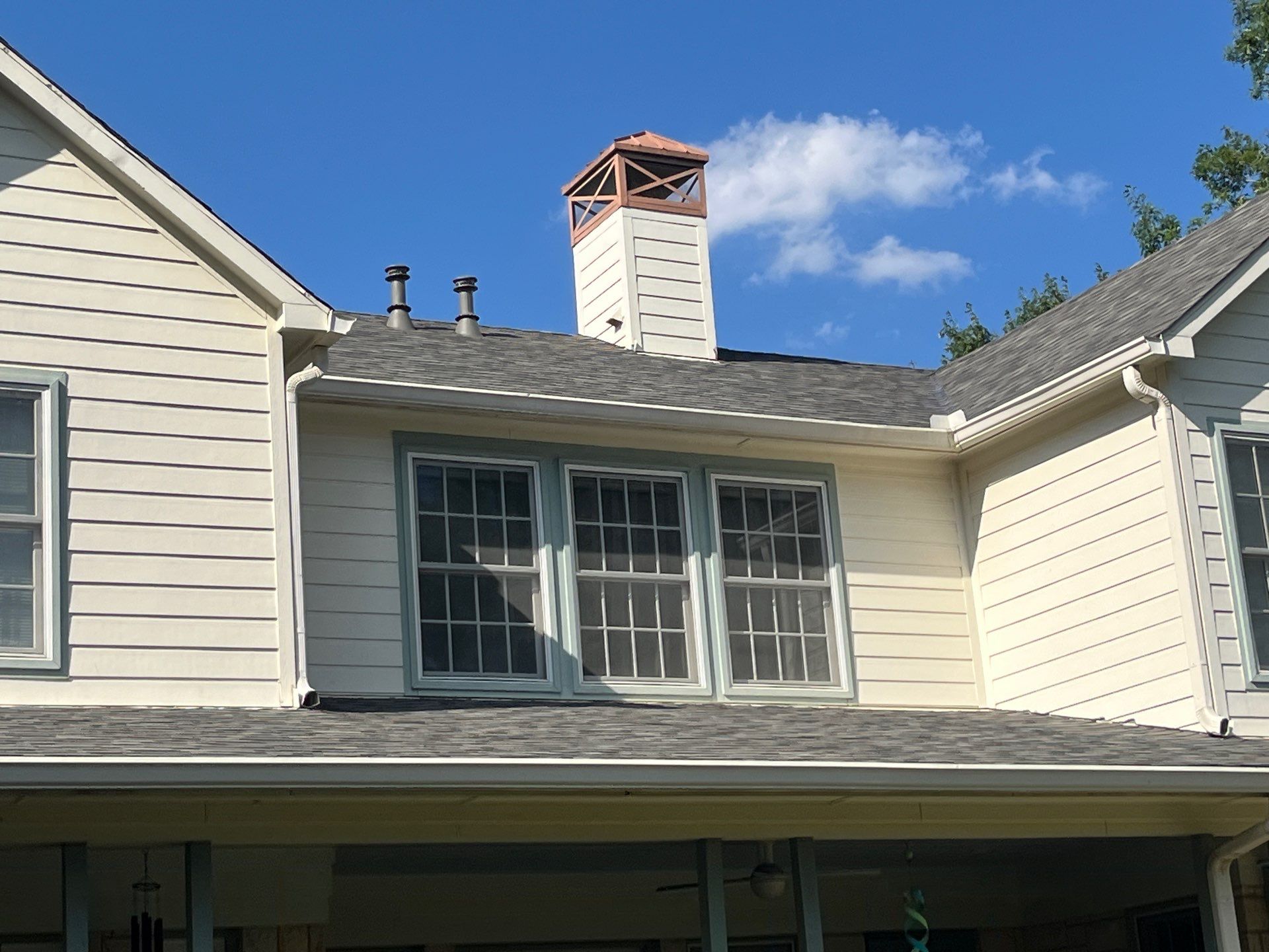 White brick with Malarkey Storm Grey by Tejas Roofworks + Restoration