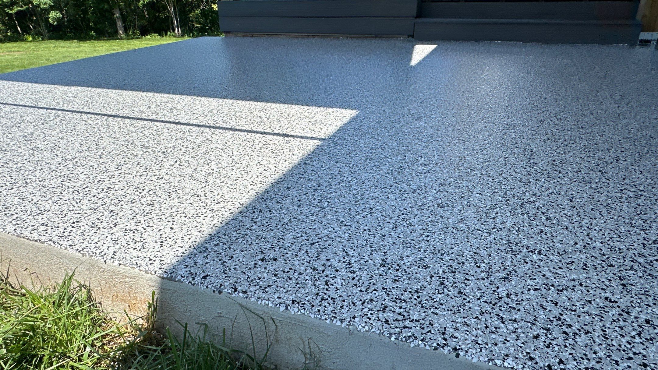 Dennis P. upgraded his garage and patio with a new flake floor by Banner Garage