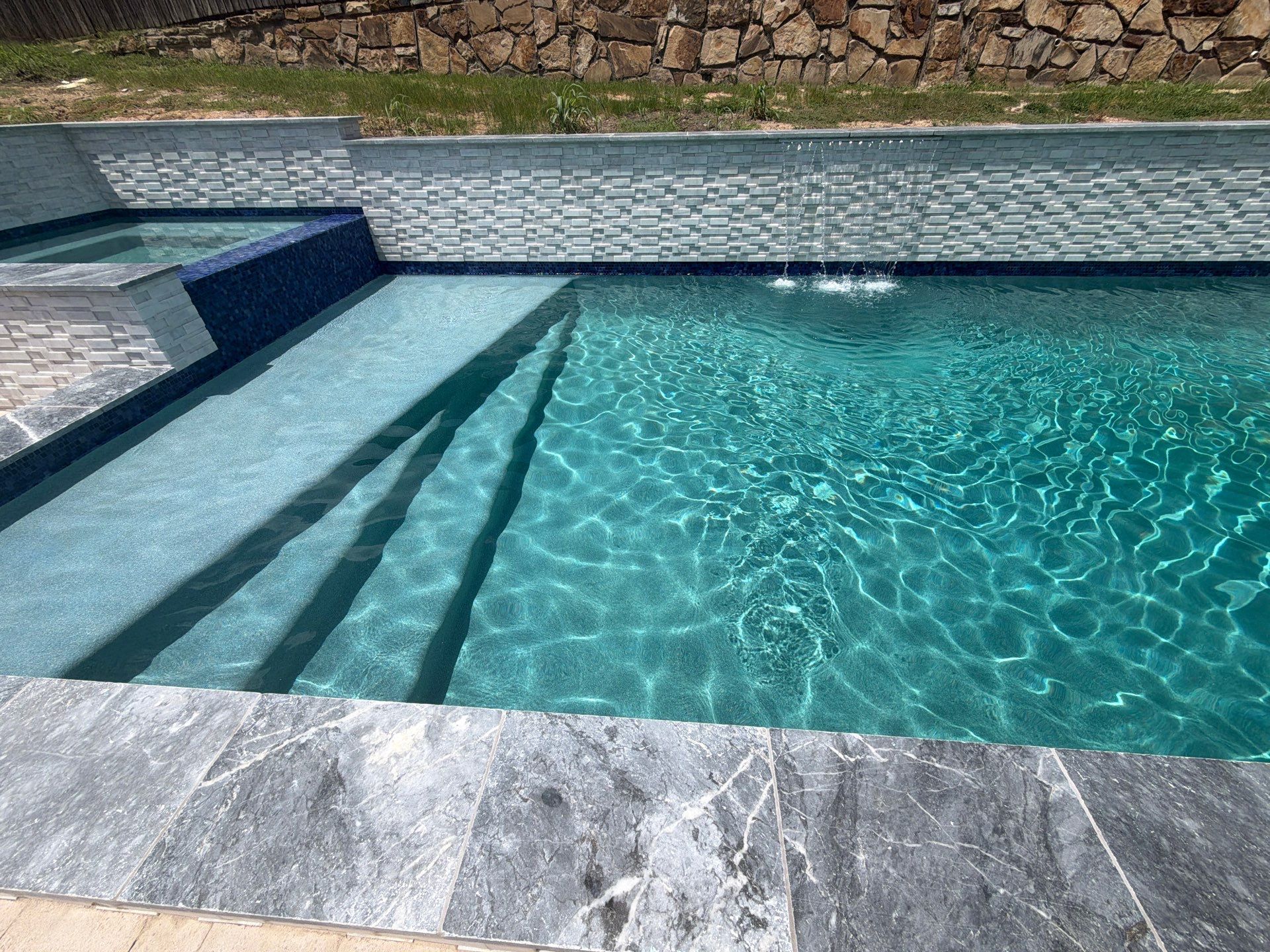 Geometric Pool with Raised Spa and Tile Spillway by Pinnacle Pools and Spas - DFW