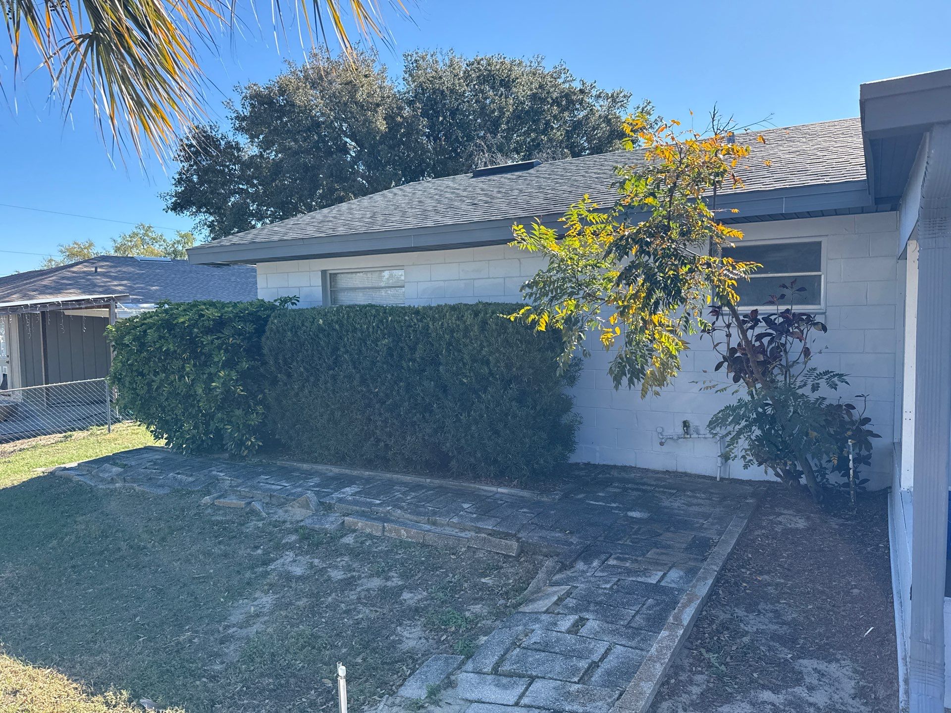 Downspout Installation using Downspout Extension and new Gutters in Winter Haven FL by Gutter Professors