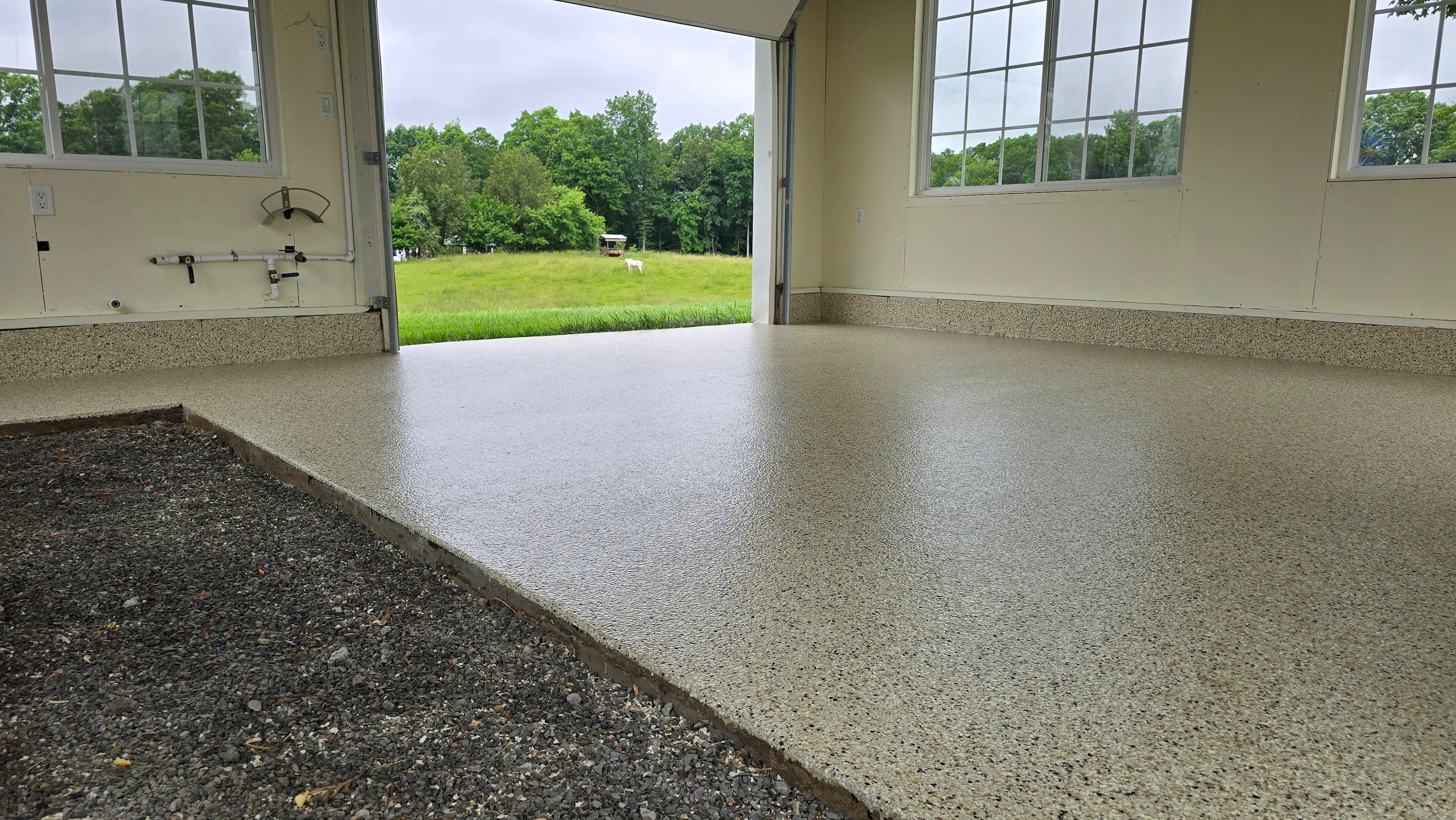 Two garages completed using Shoreline and Midnight by Elite Floor Solutions