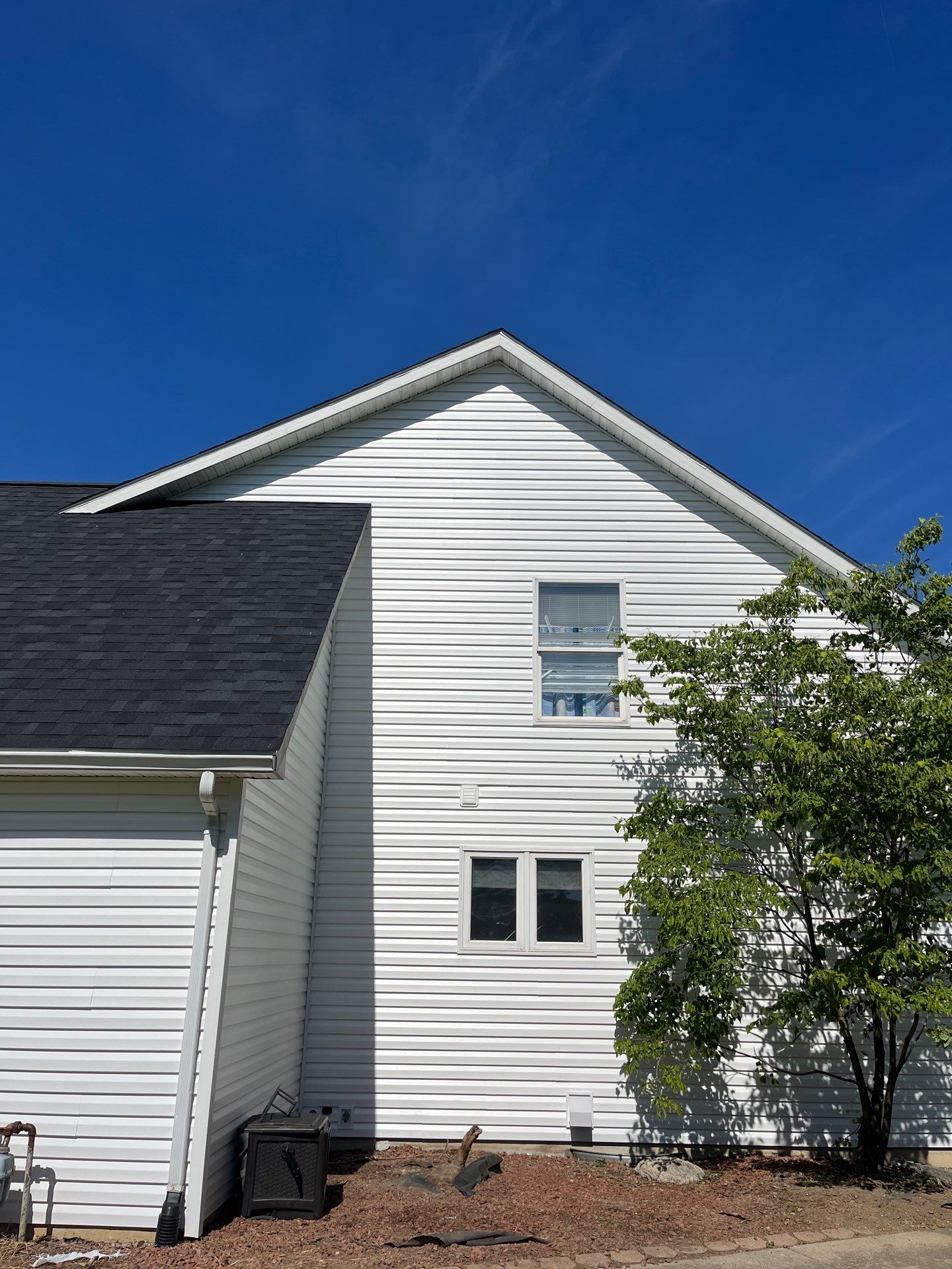 Exterior Installation using Onyx Black Durations and White Siding by WIW Enterprises Inc