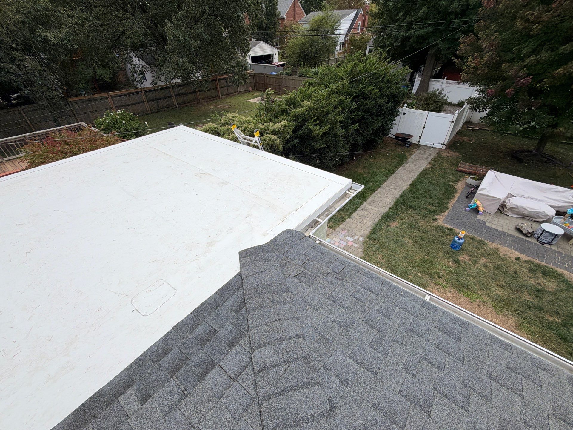 Richmond Roof Replacement Including Flat Membrane and Asphalt Shingles by Cade Construction