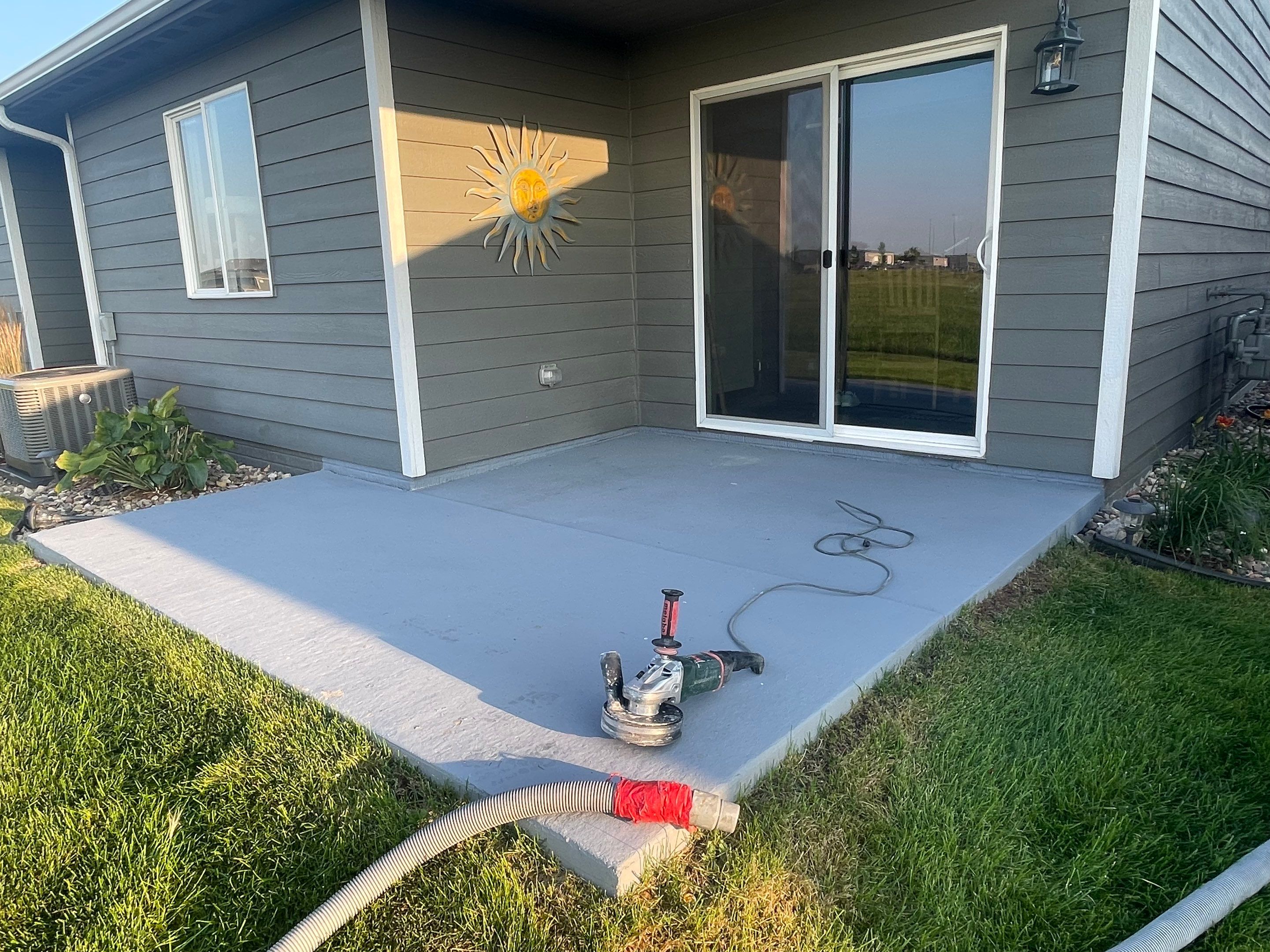 Starry Evening Concrete Patio Coating Installation in Tea by Select Painting, Coatings & Garage Cabinets