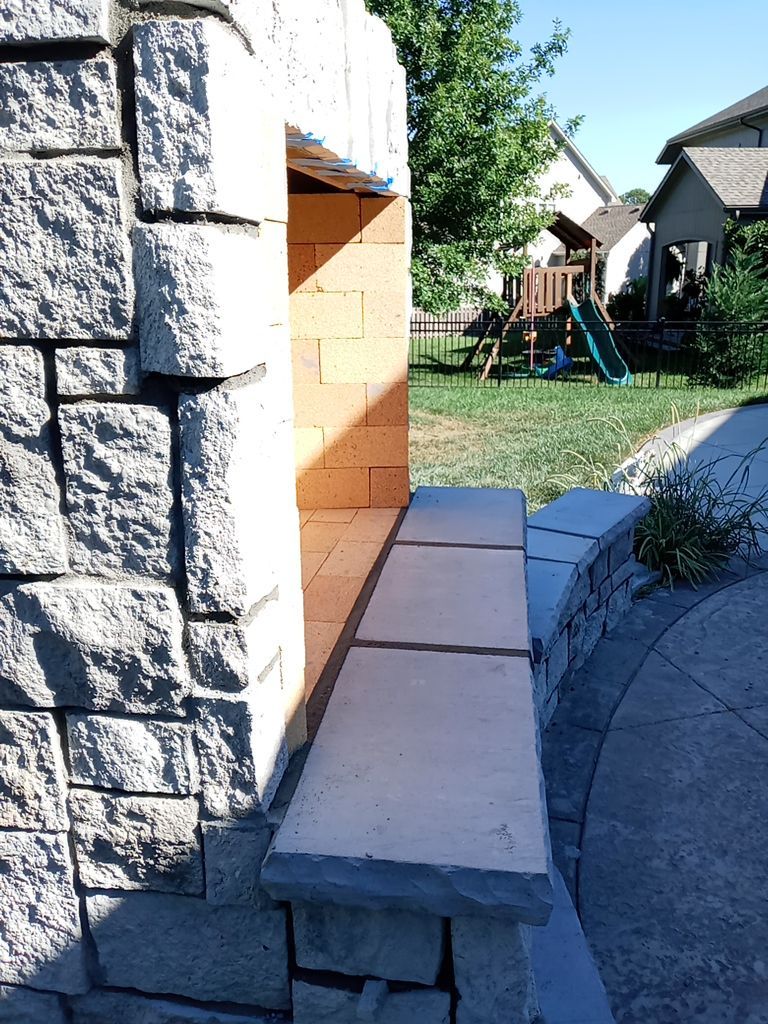 Back Yard Fireplace and Landscape by LAND ESCAPES LLC