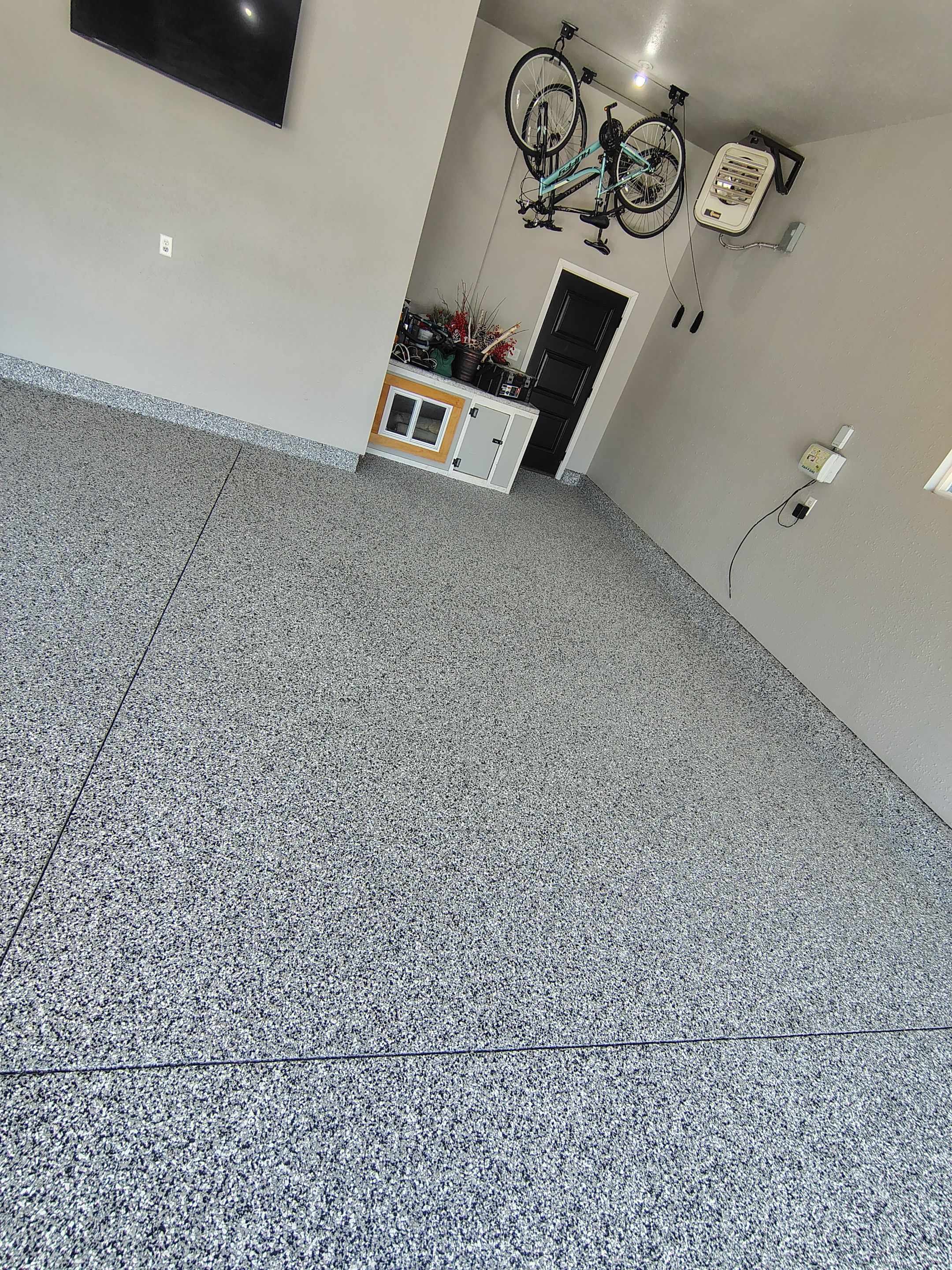 Custom Gray Flake Garage Floor Coating in Sioux Falls by Select Painting, Coatings & Garage Cabinets