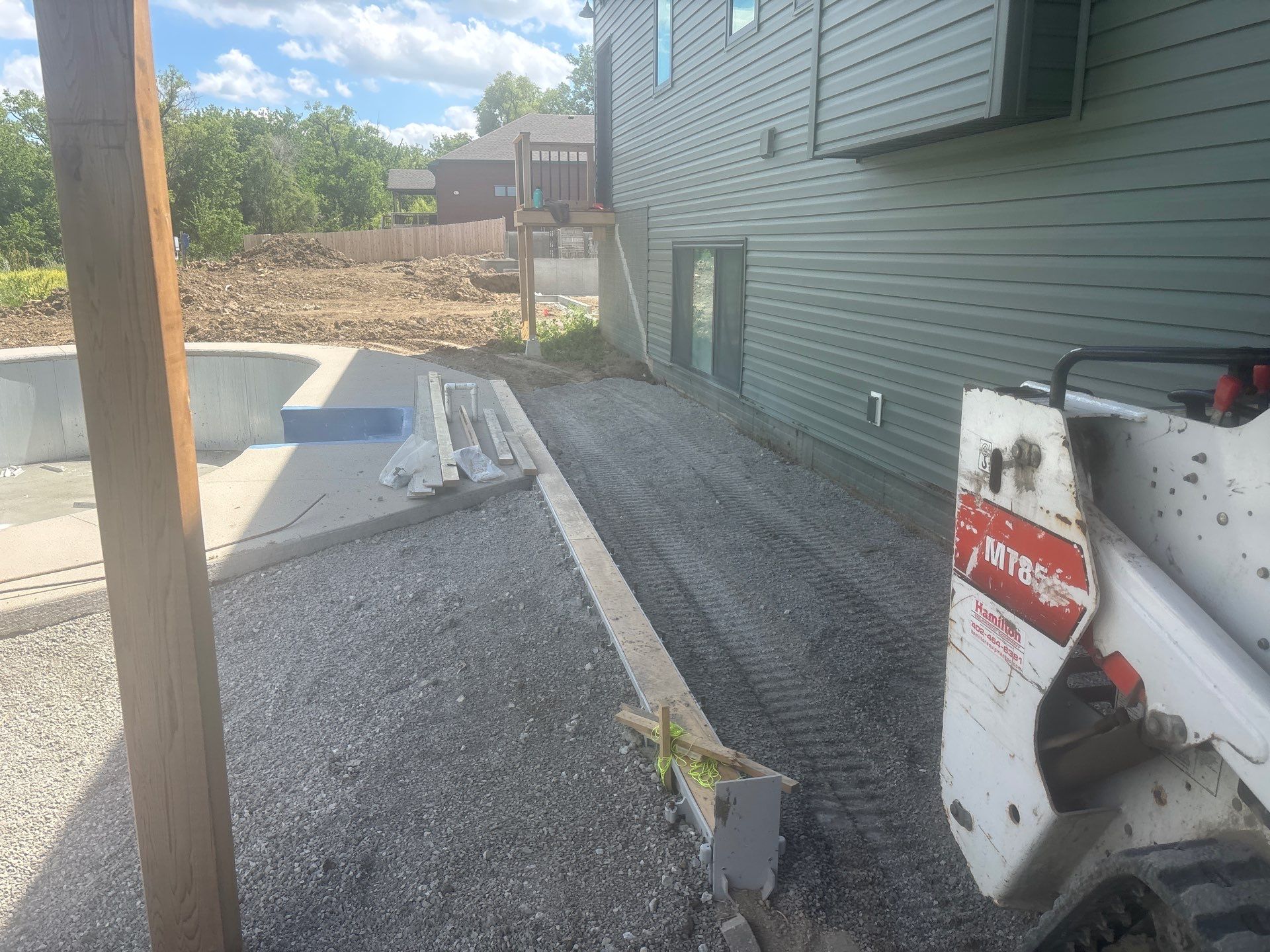 New Residential Construction - Paver, Putting Green, Pool by New Horizon Landscapes