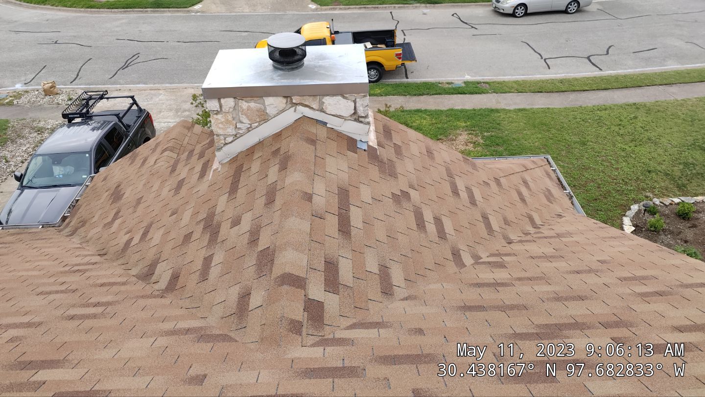New Roof Installation Of IKO Dynasty Color Brownstone by DeZign Roofing & Exteriors