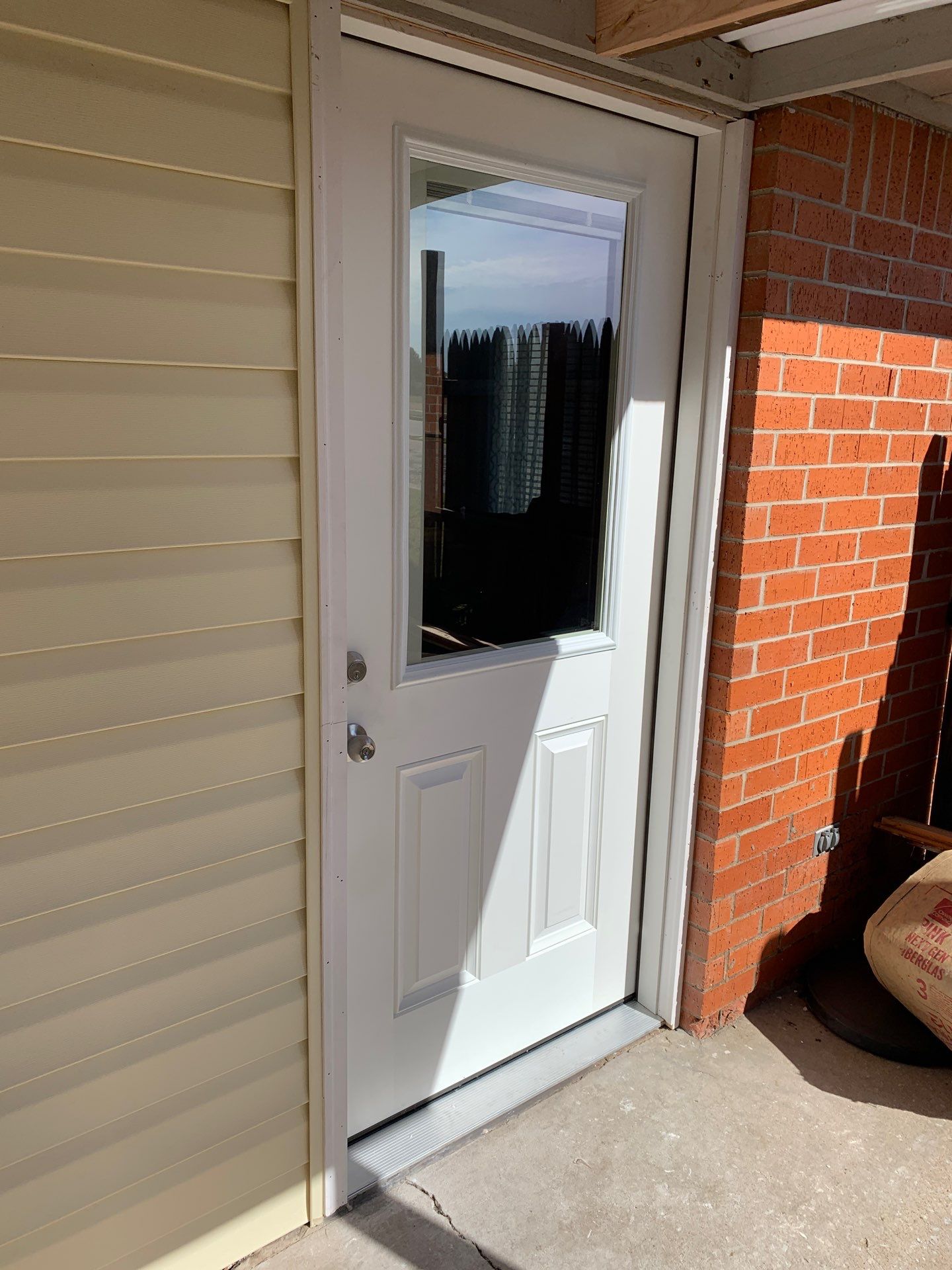 Siding Replacement and Door Replacement in Norman, OK by McCann's Roofing and Construction