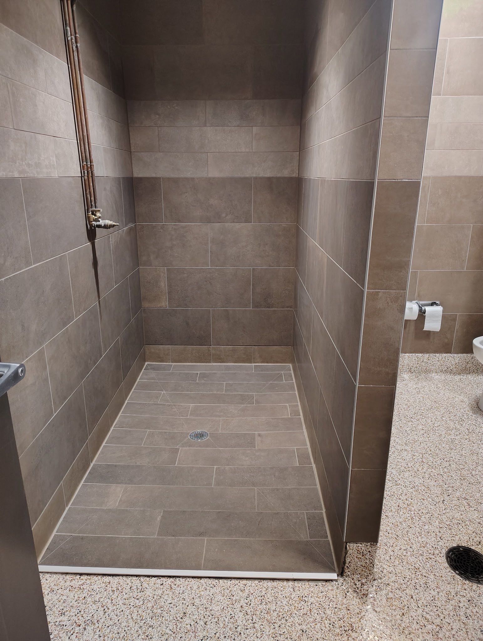 Trucking company showers by Footprints Floors of Nashville