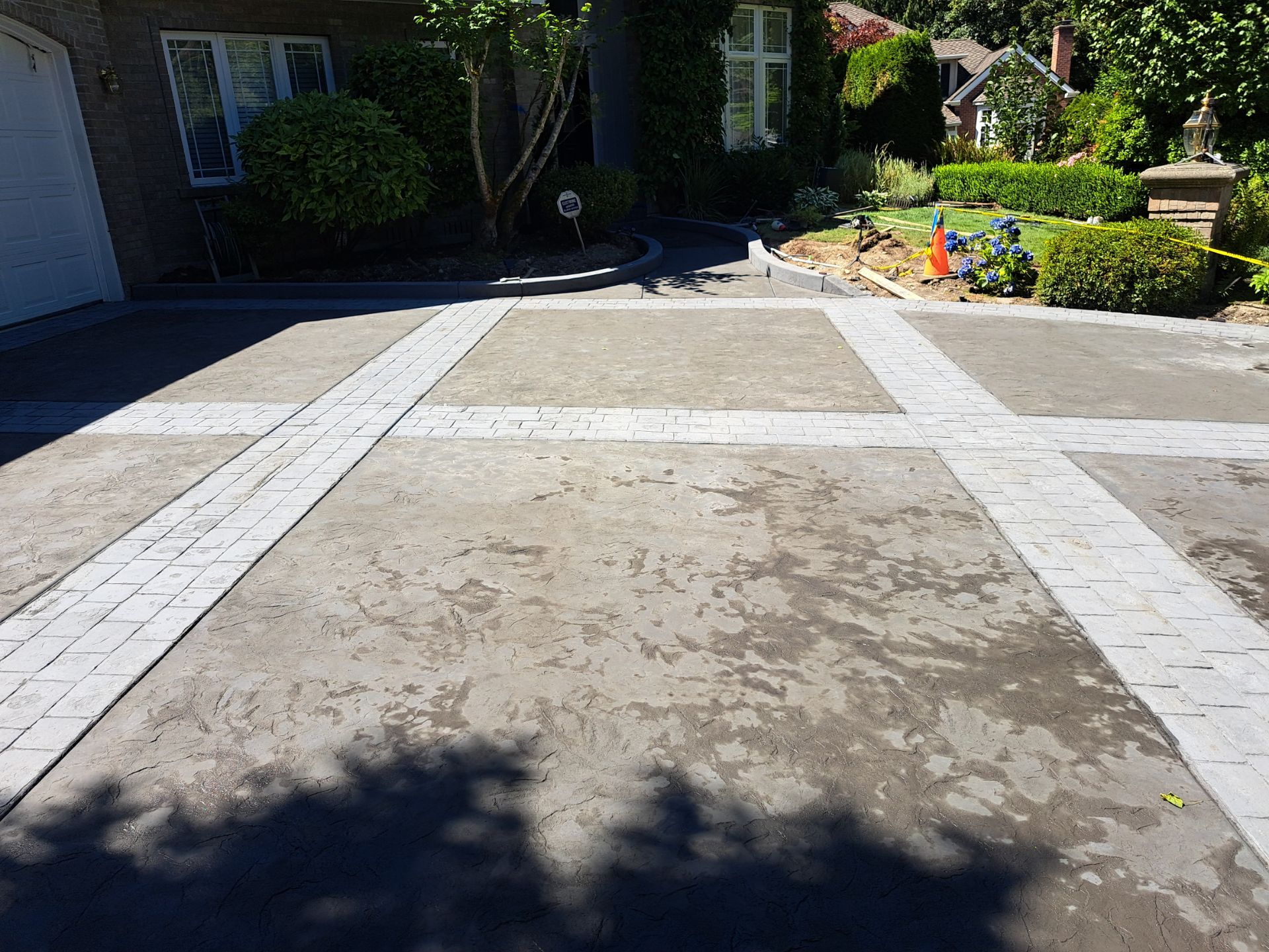Multi-color Stamped & Sealed Concrete Driveway Renovation | Mukilteo by Jireh Asphalt & Concrete Inc